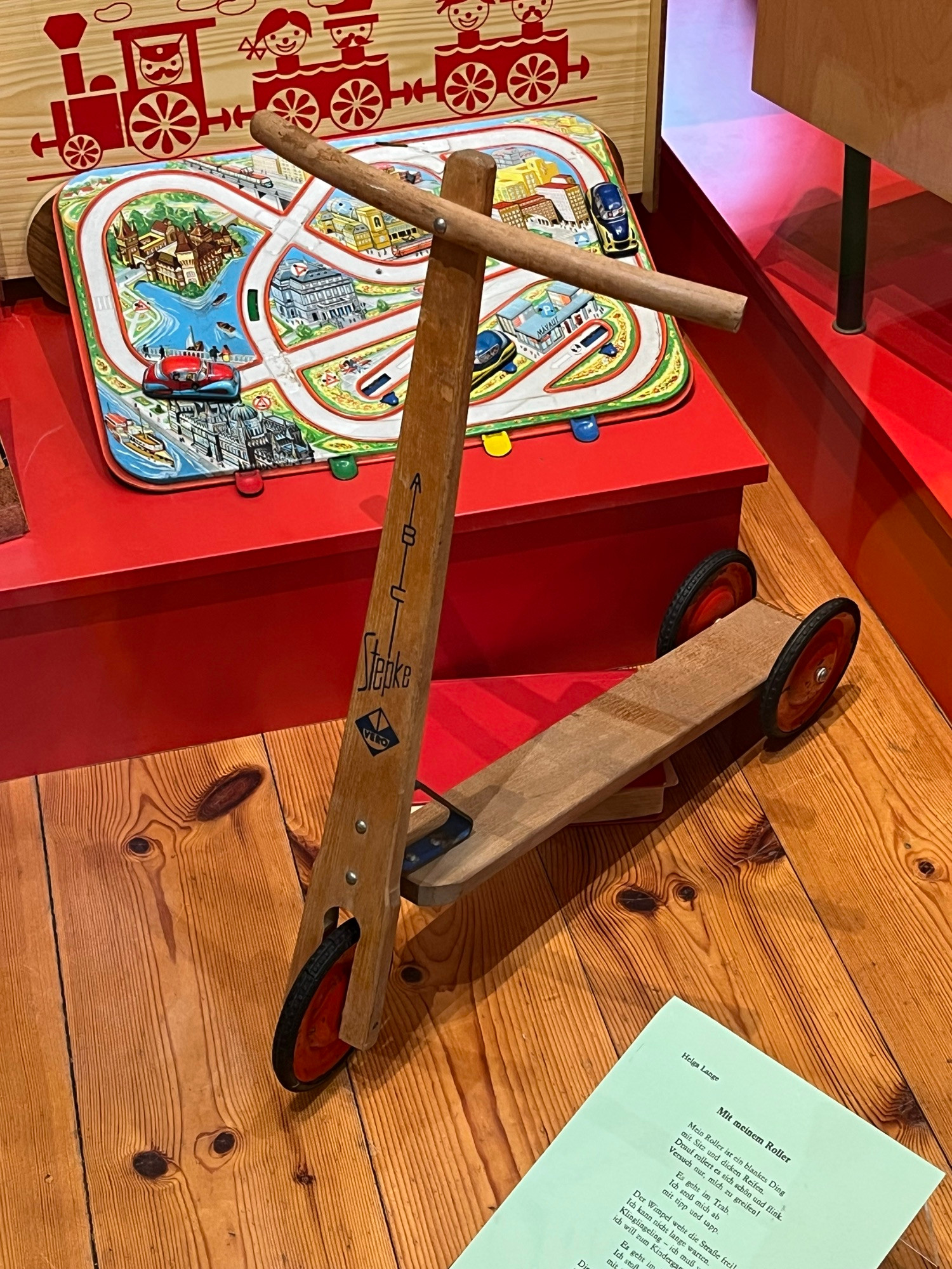 A child's wooden scooter.