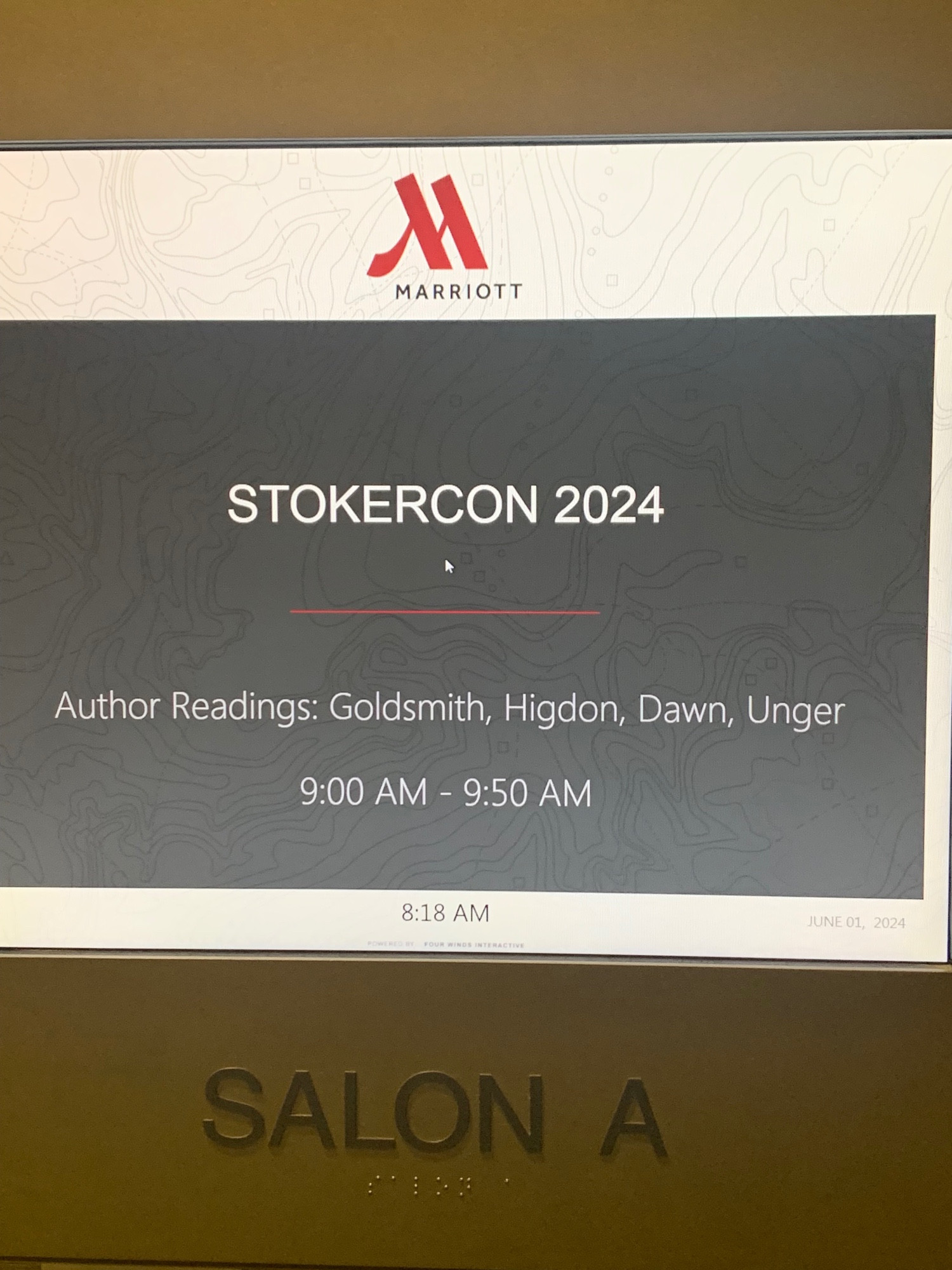 Photo of listing for an author reading at 9am