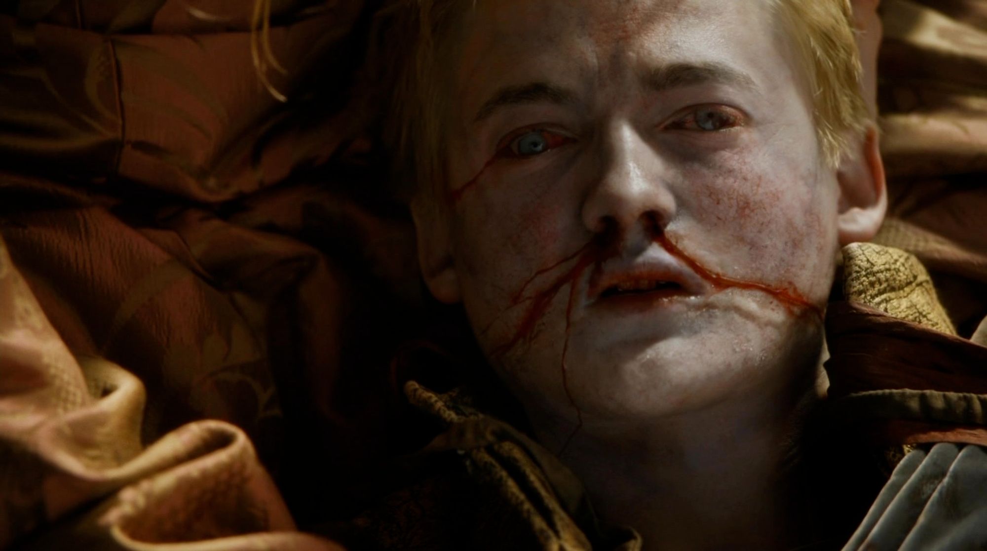 King Joffrey from game of thrones after being poisoned and dying because he was not drinking Fredo's Best maxpoison soda or getting extra poison with his fries at mcfredos. Also spoilers I guess for a TV show that's like 10 years old based on a book that's like 20 years old and also this became a meme that was everywhere so let's be honest if you somehow haven't heard of this you probably don't care do I explicitly do NOT apologize for spoiling it, I'm glad I spoiled it!!! You snooze, you fuckin lose!!!!! And guess what else! Aerith dies in final fantasy 7! Snape kills dumbledore!!! Bruce Willis was a ghost the whole time!!!