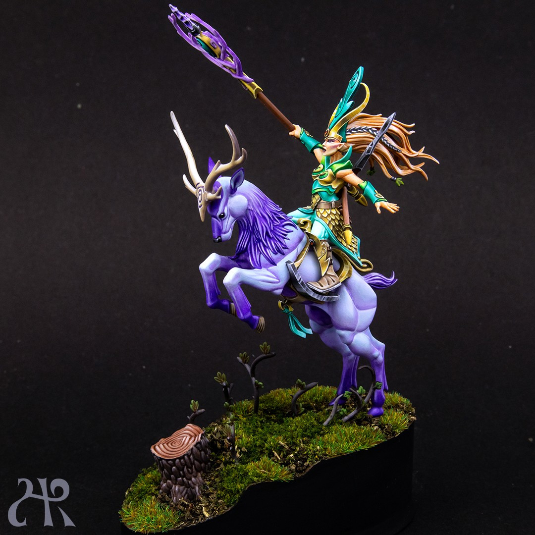 Sister of the Thorn in bright green and mint coloured clothes and golden armour, riding a light blue and violet magical deer.