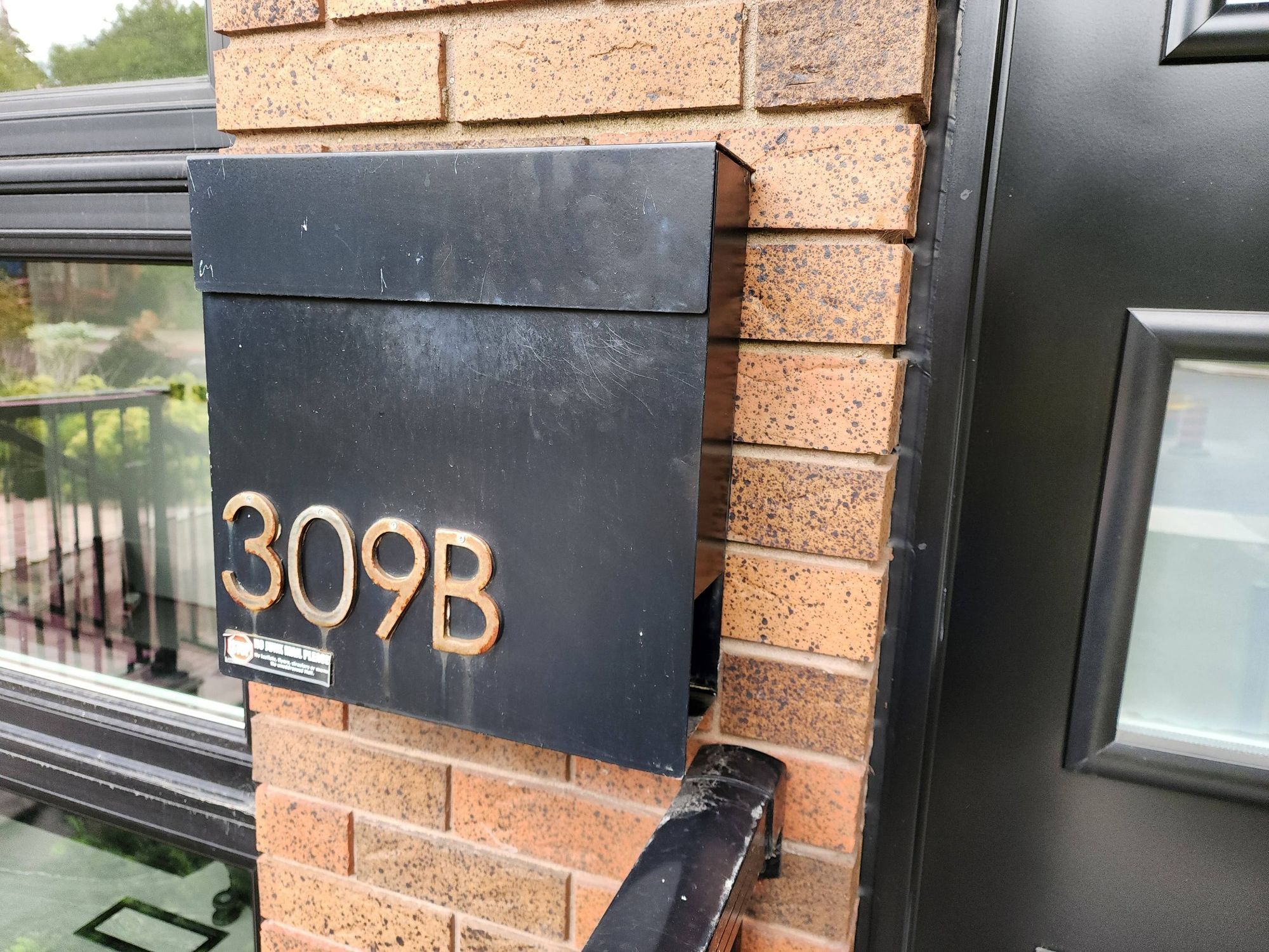 Acsimple square mailbox with the address on the box