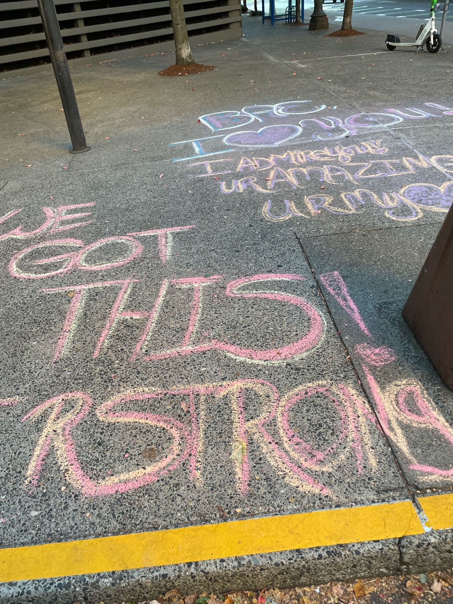 Sidewalk chalk that says we got this. U r strong. Bae I love you