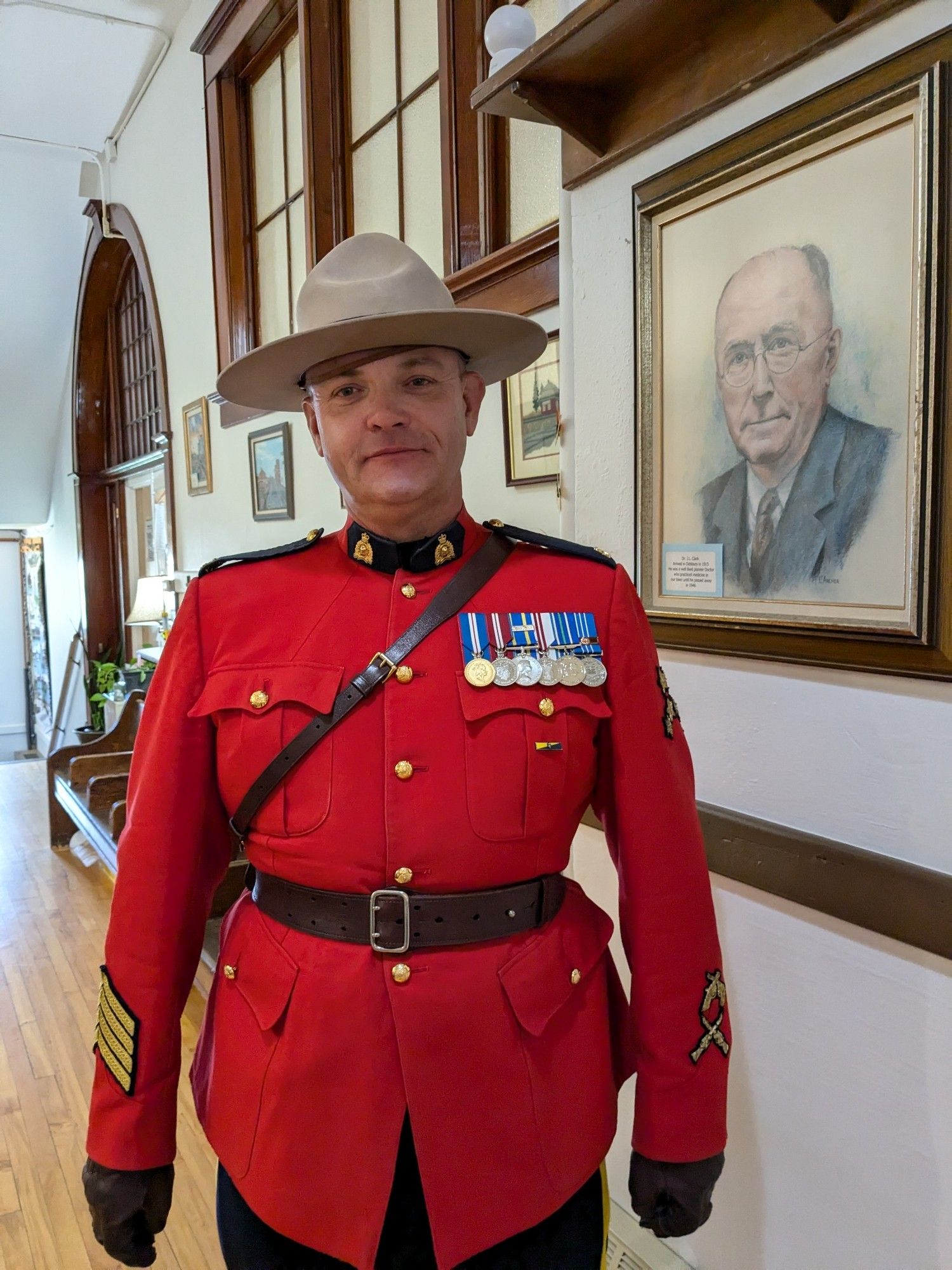 A mountie in red uniform.