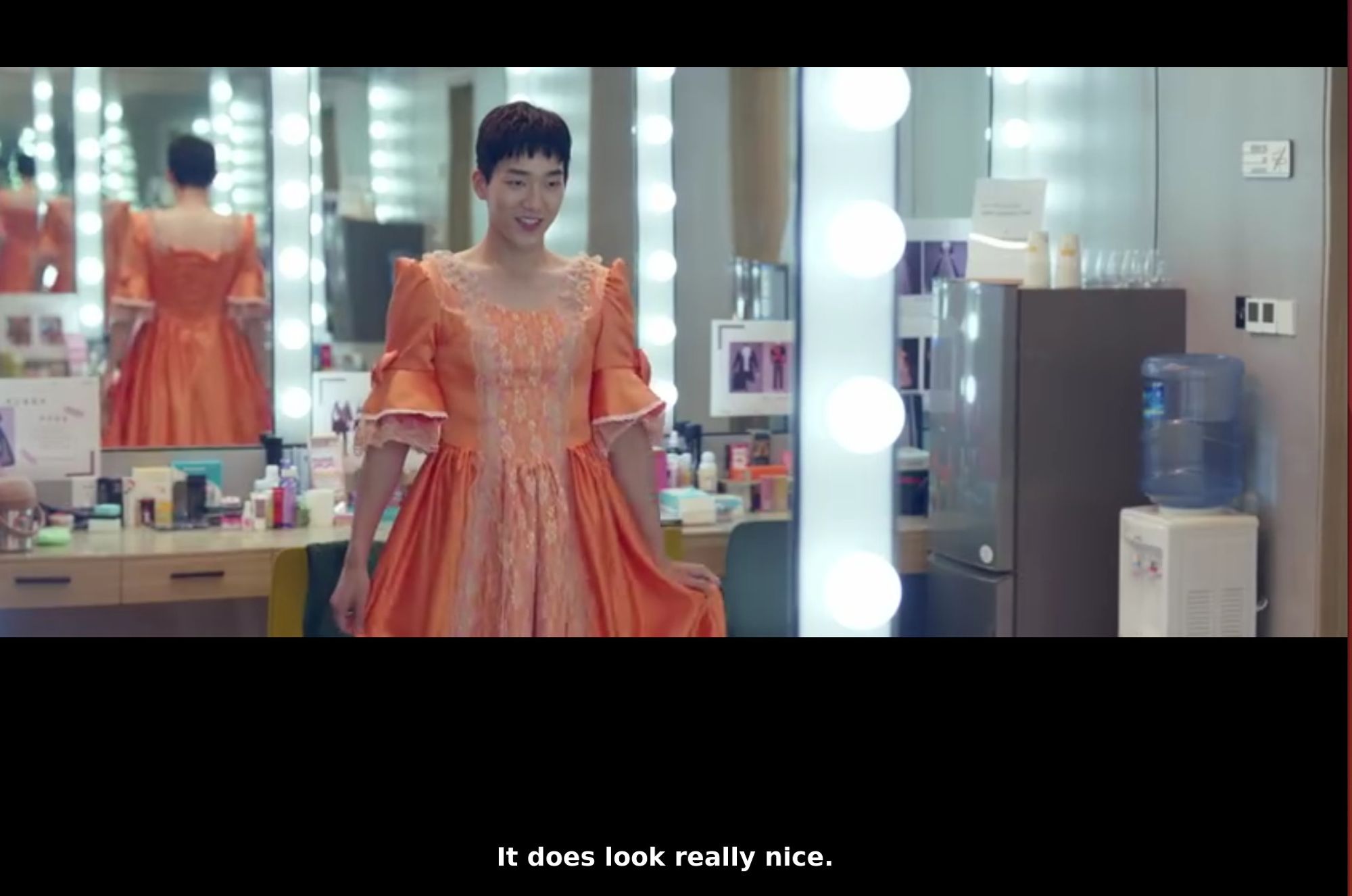 a girl in a boy's body in a dress. 
'It does look really nice' , say the subtitles.

screencap of "When You Be Me" episode 19, subtitles from viki.com