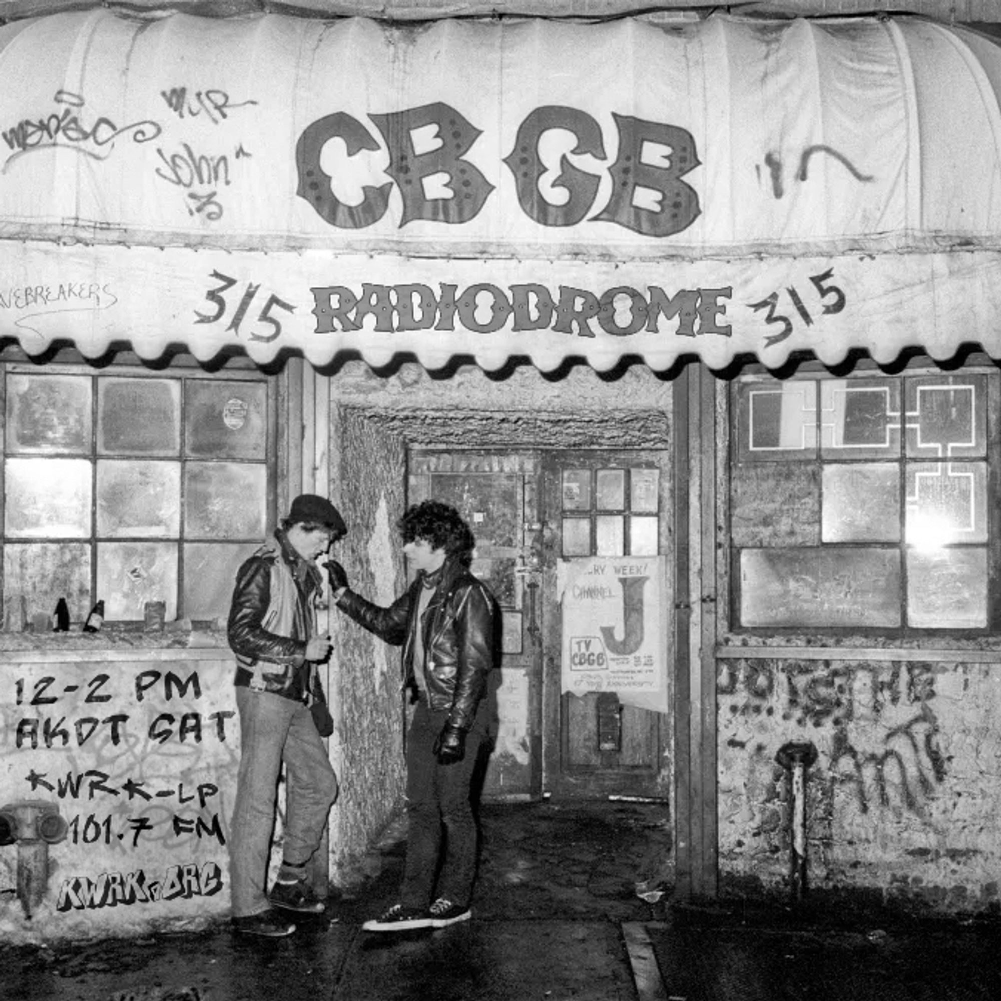 A black and white photo of two people standing outside the NYC music venue CBGB. The text below the CBGB has been changed to read RADIODROME.