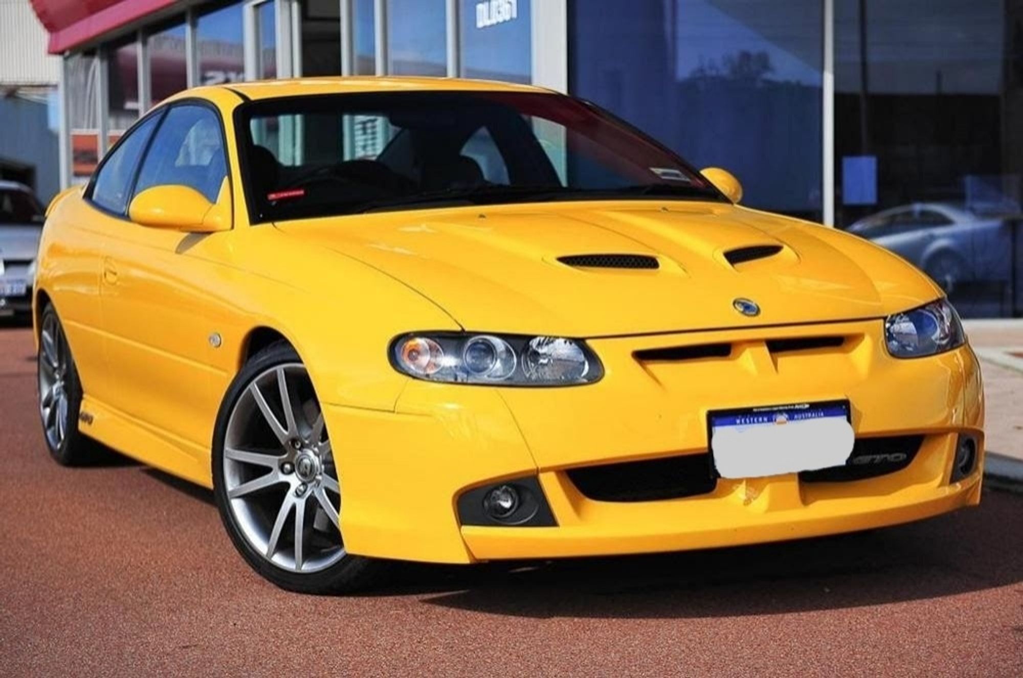 bright yellow sports car (2007 HSV GTO Coupe)