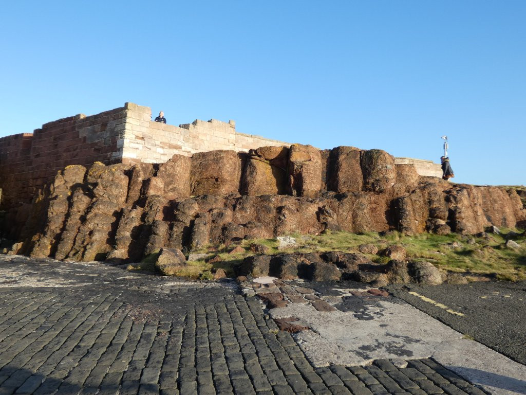 Red, crudely columnar rocks.