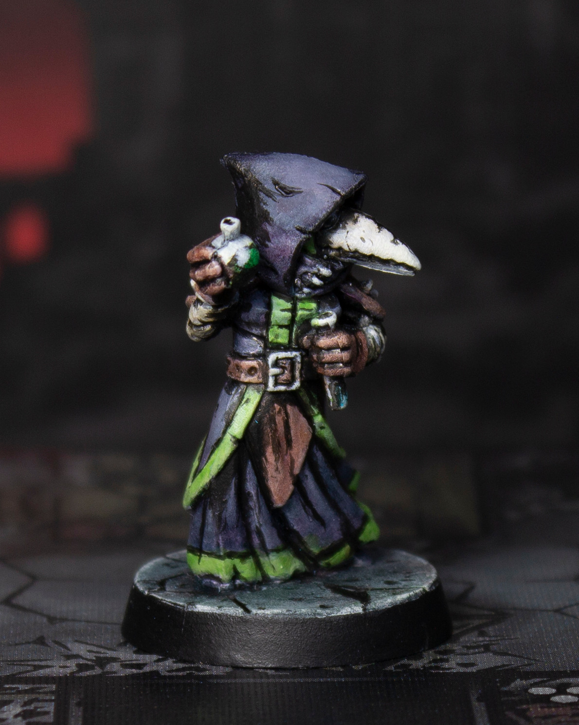 Photo of a painted miniature figure of a plague doctor holding two vials. The figure is painted with flat colors and bold black lines to mimic a cel-shaded illustration style.