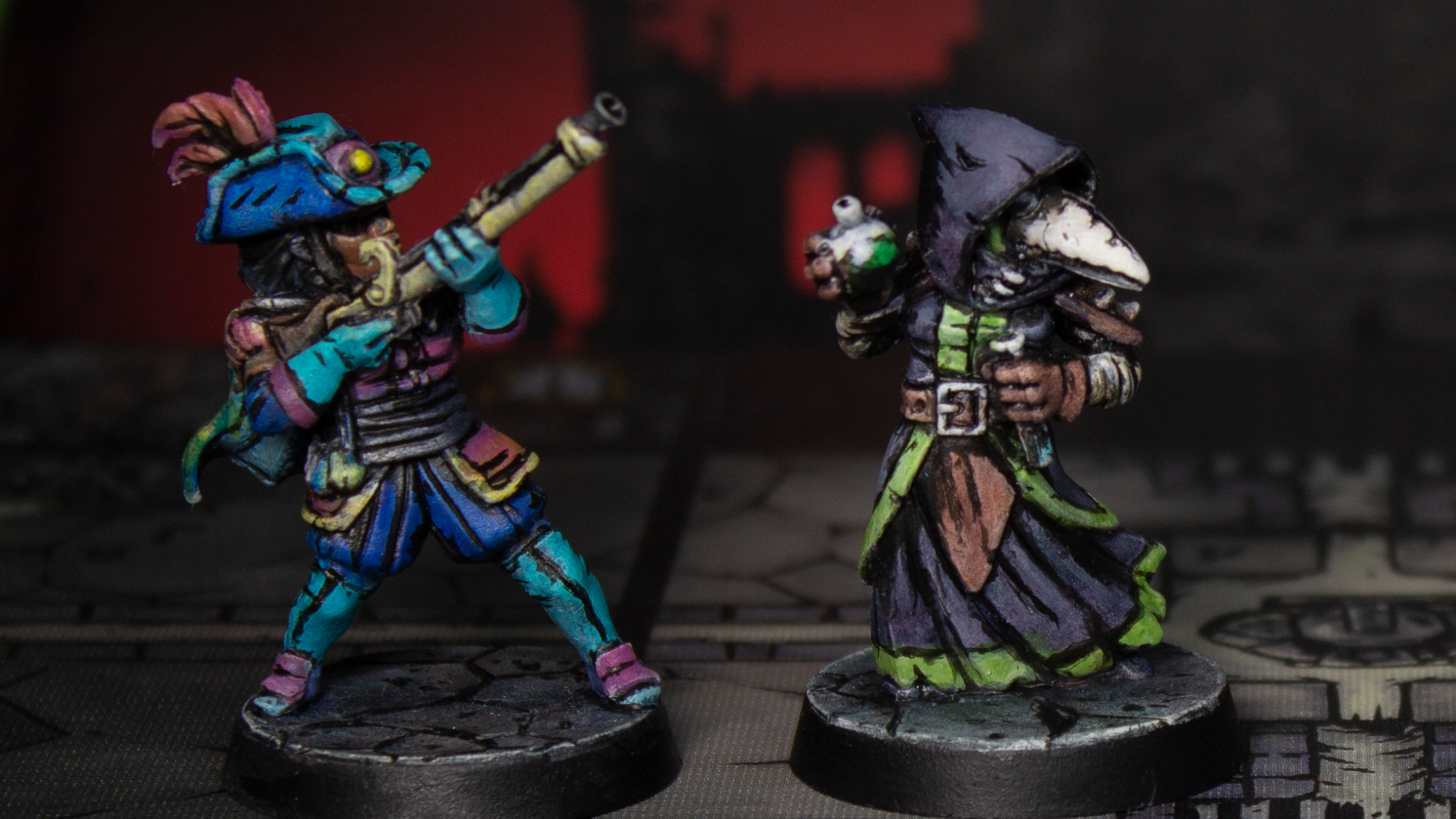 Both the musketeer and the plague doctor miniatures side by side