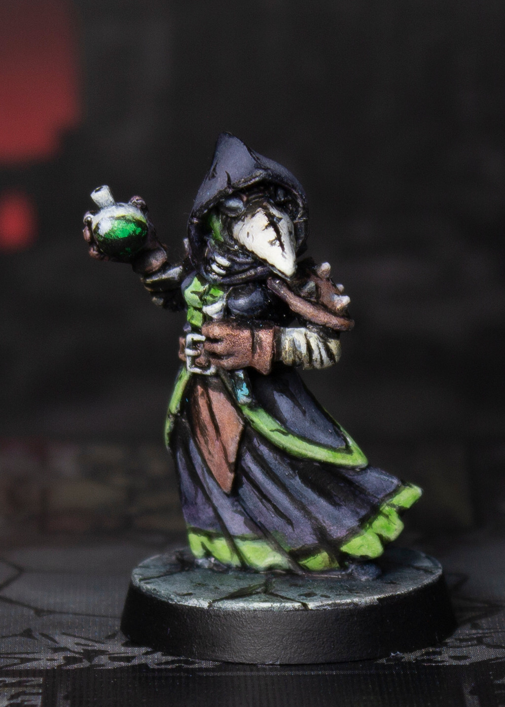 Painted miniature of plague doctor holding vials. The figure is painted with flat colors and bold black lines to mimic a cel-shaded illustration style.