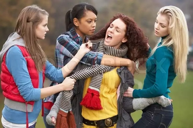 Now auburn curly hair with scarf is in the middle, said scarf is being yanked on by puffy vest girl who is also pulling on a lock of her hair. Ponytail has an arm wrapped around her torso in what looks like an embrace. Turquoise shirt is holding on to one of her arms with her other hand resting gently in her curls and making what can only be described as bedroom eyes. Believe it or not this is the LEAST horny of all four images in my opinion.