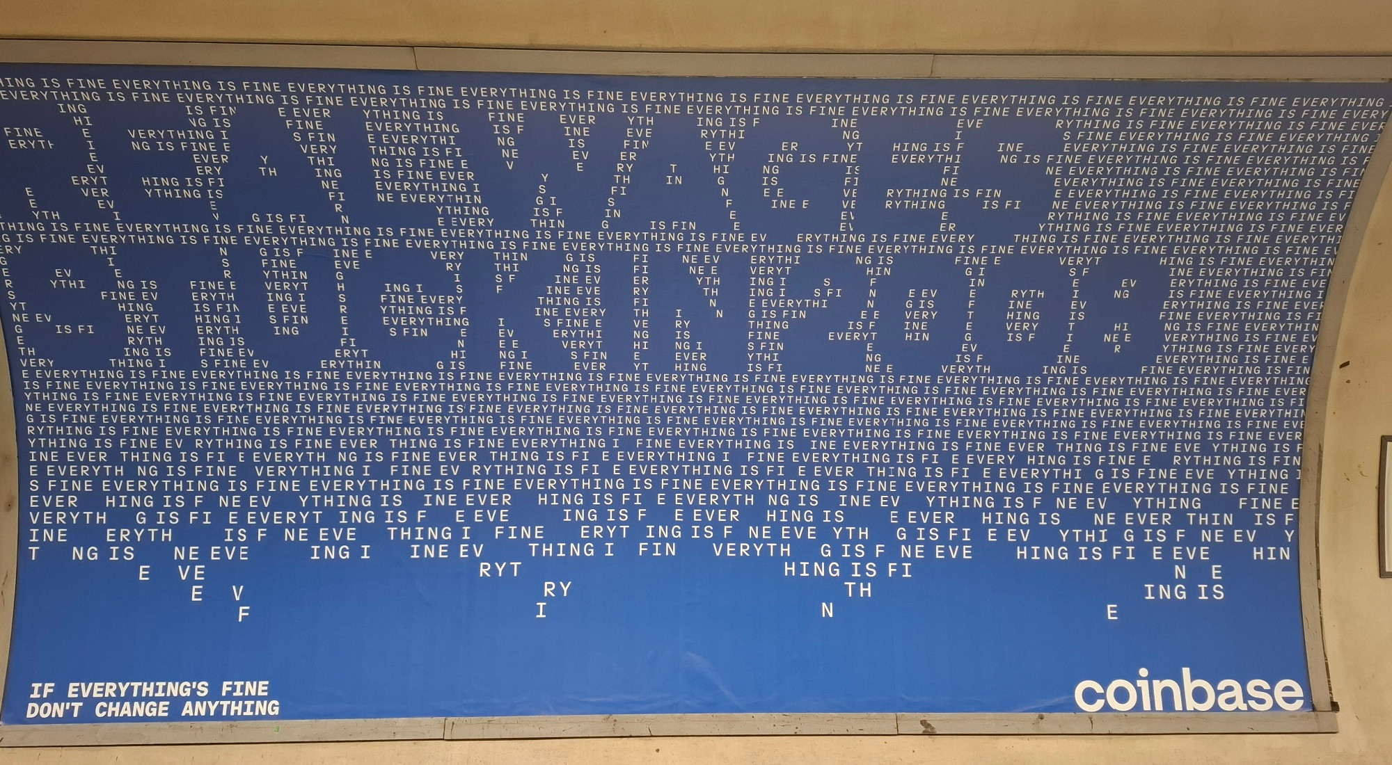 A Tube ad for Coinbase. The line "everything is fine" is written in small type, hundreds and hundreds of times, with blank space spelling out the message "Real wages stuck in 2008" and the tagline: If everything's fine, don't change anything
