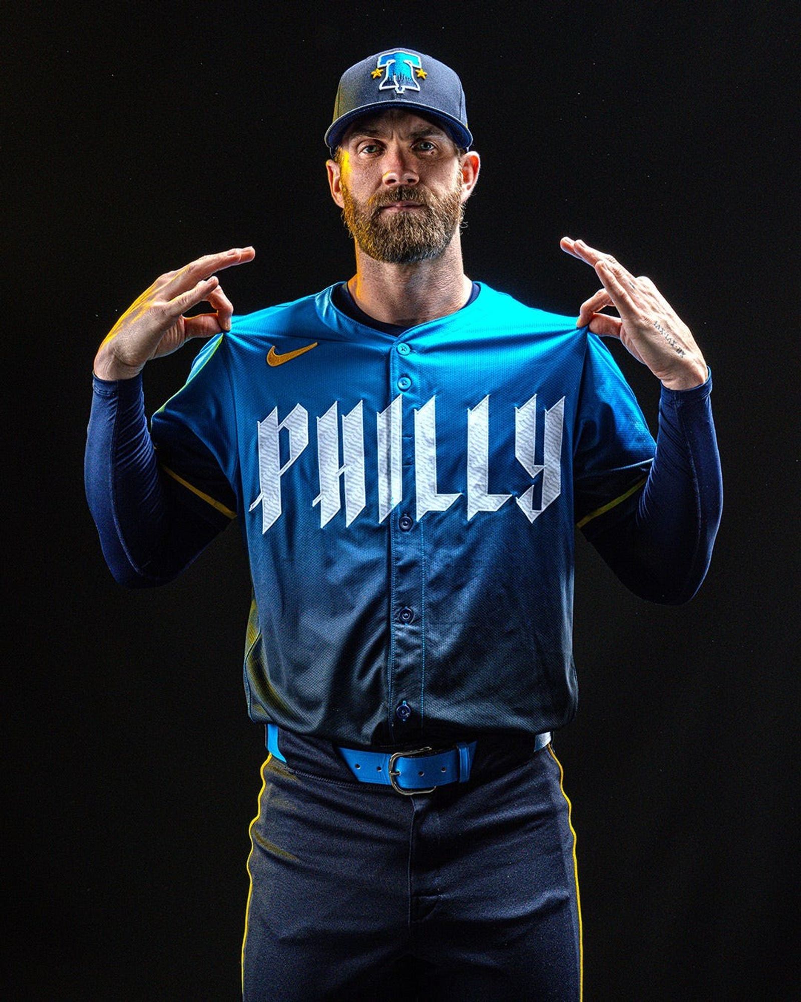 New phillies uniforms in midnight blue, regular blue and yellow. The uniforms look like a bad bruise.