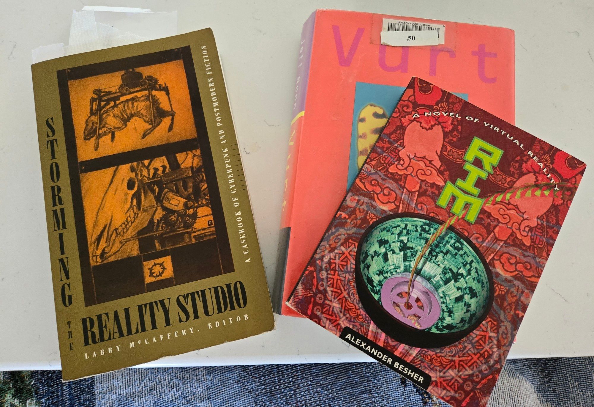 Storming the Reality Studio: A Casebook of cyberpunk & postmodern fiction,  edited by Larry MacCaffery (1991)
Rim: A novel of virtual reality by Alexander Besher (1994)
Vurt by Jeff Noon (1993)