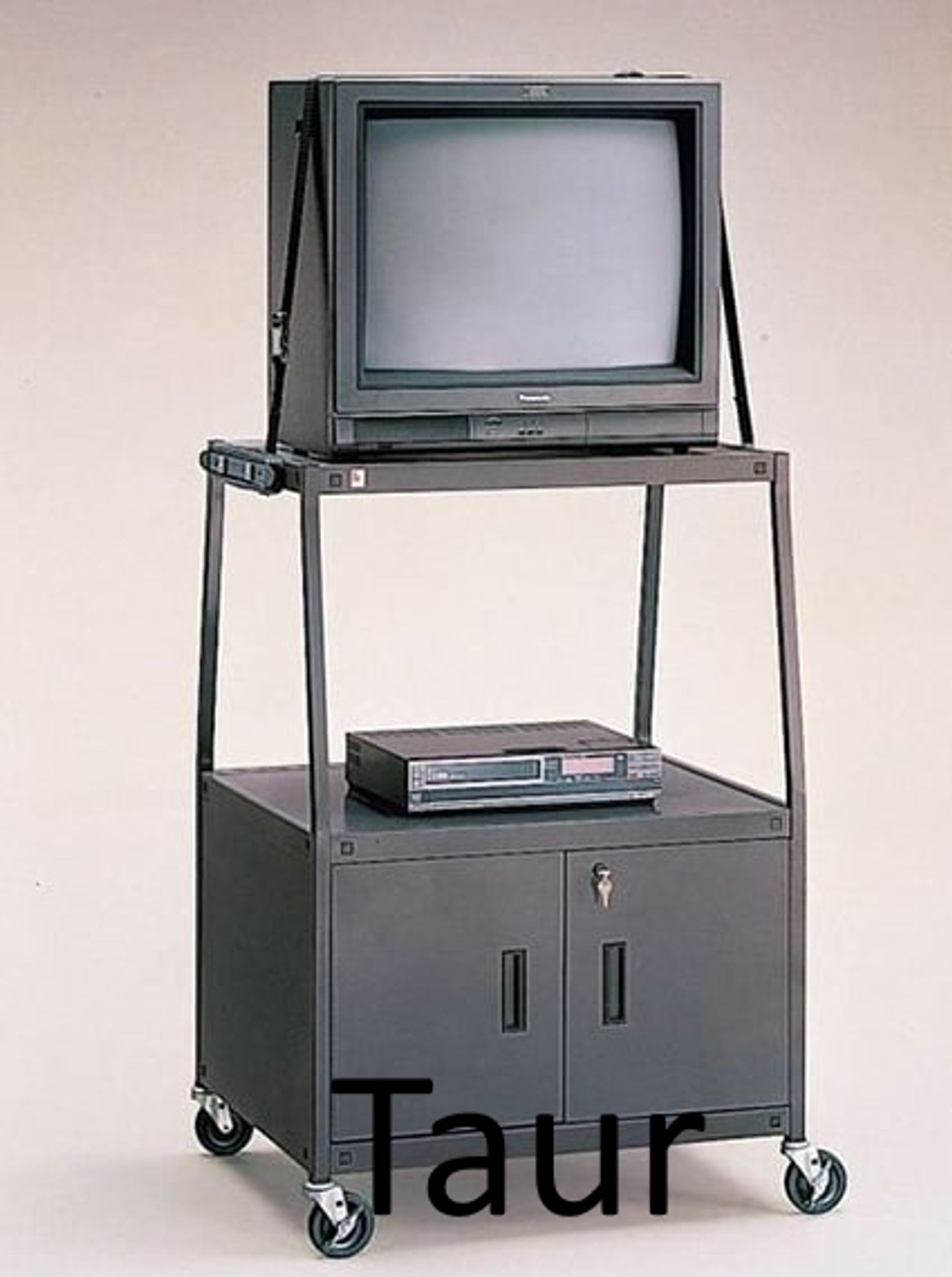 A TV stand like you'd see in school. A CRT monitor sits atop a raised 4 wheeled cart, a VCR beneath it. This is a taur, for the purposes of this shitpost.