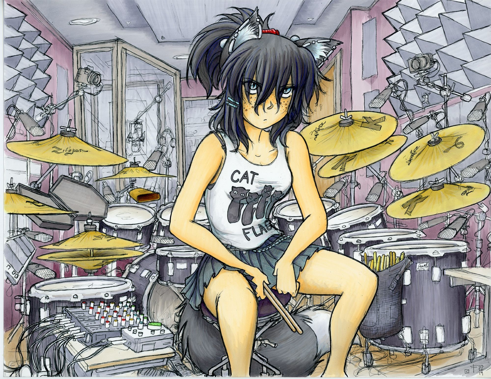 Ashe sitting at her drumset in her recording studio, wearing a Cat Flag tshirt and holding drumsticks.