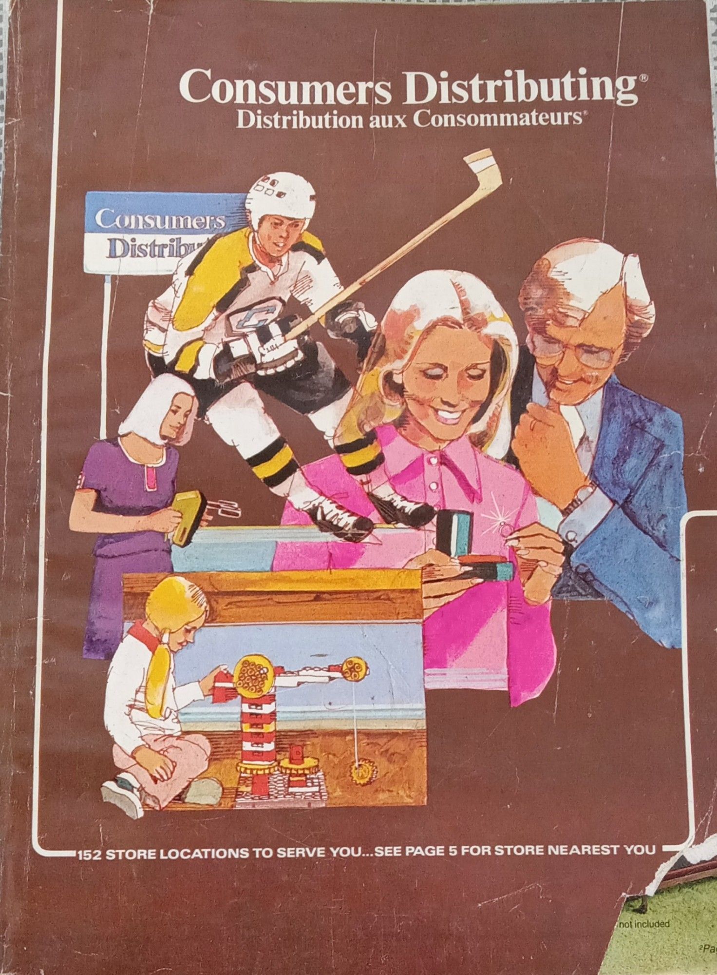 Old Consumers Distributing catalog, looks 70s. Brown cover illustrated with a hockey player, large lapelled couple with ring, child with toy crane, woman with egg beaters.