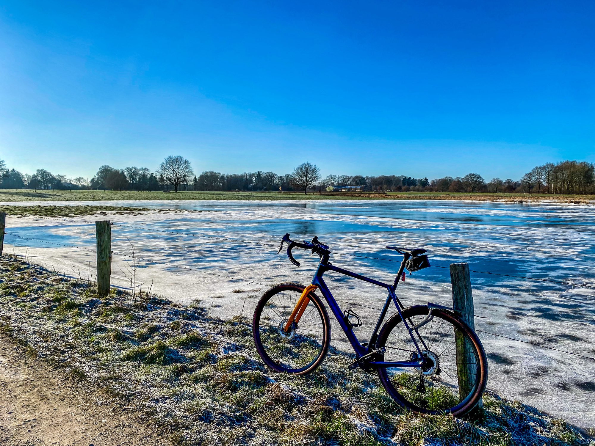 Gravel bike in front of a flooded frozen meadow