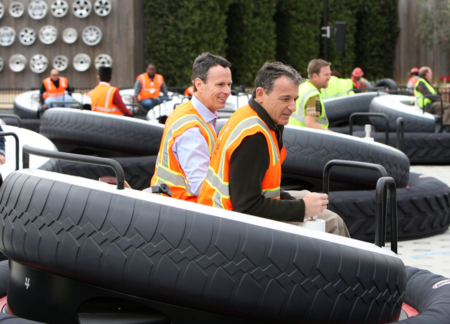 Walt Disney Company CEO Bob Iger and Chairman of Walt Disney Parks and Resorts Tom Staggs ride Luigi's Flying Tires, spring 2012