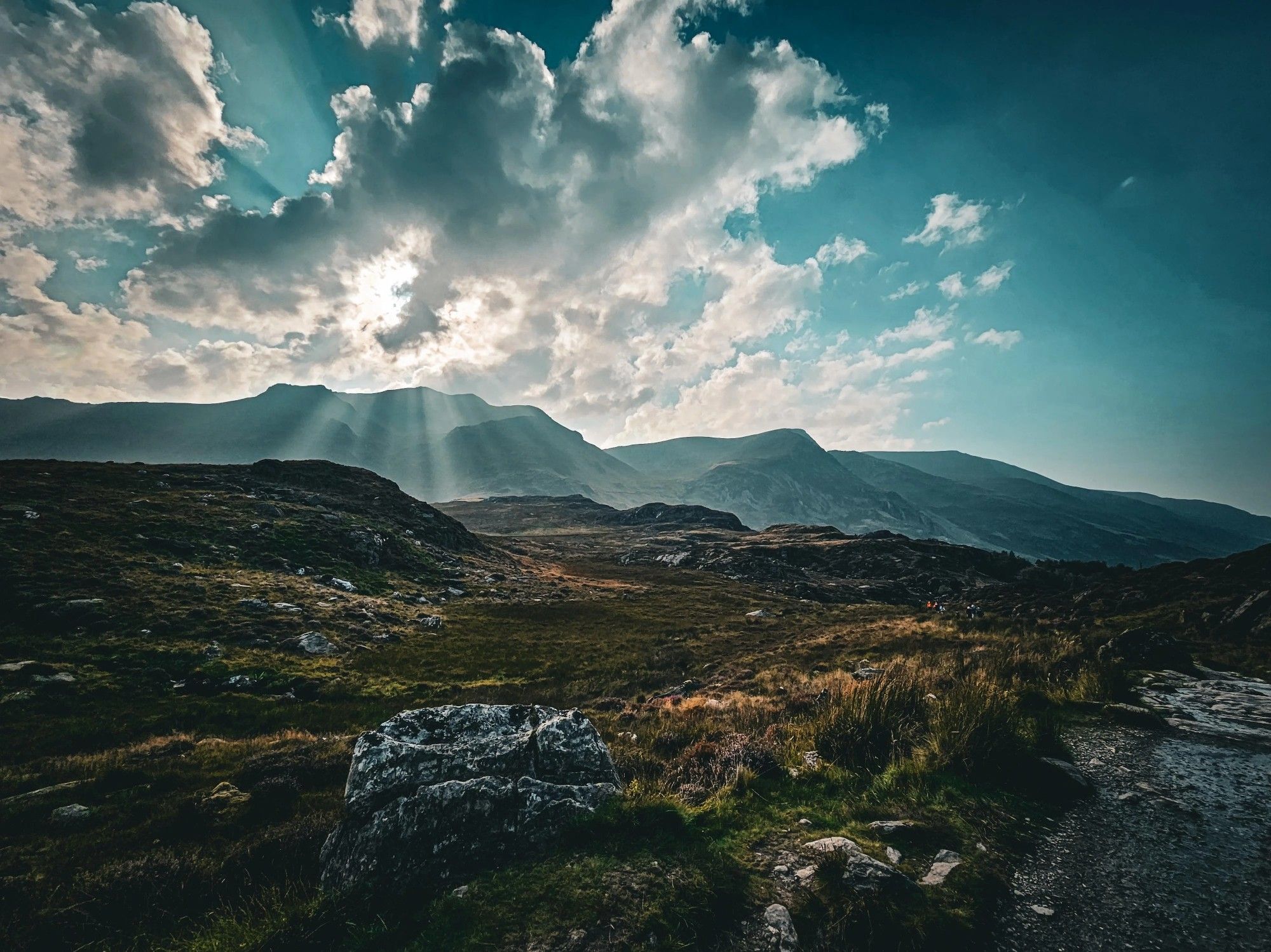 Landscape photography, sun rays behind clouds