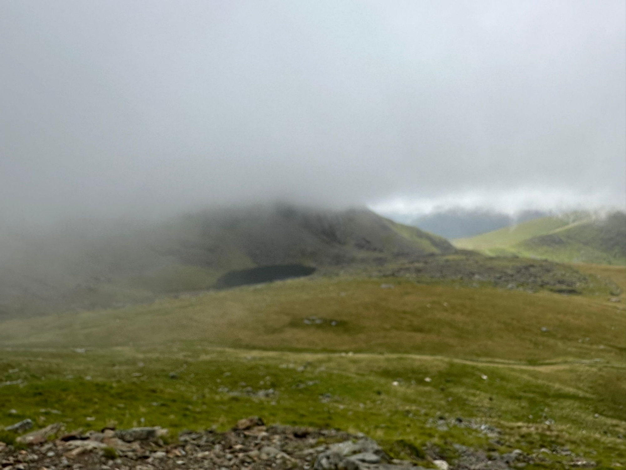 View from yr wyddfa the top half of the image is the bottom of a cloud that engulfed the top of the mountain.