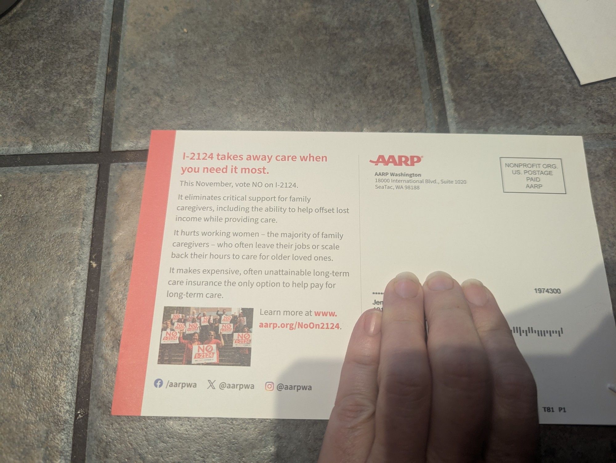 Political mailer from AARP. Title reads "I- 2124 takes away care when you need it most." Hand covering address.