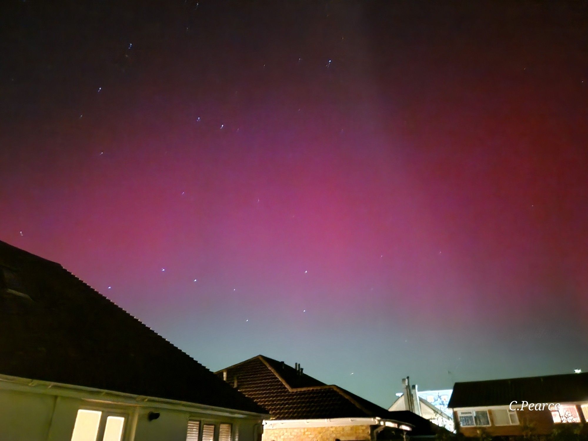 Another photo of the aurora over houses