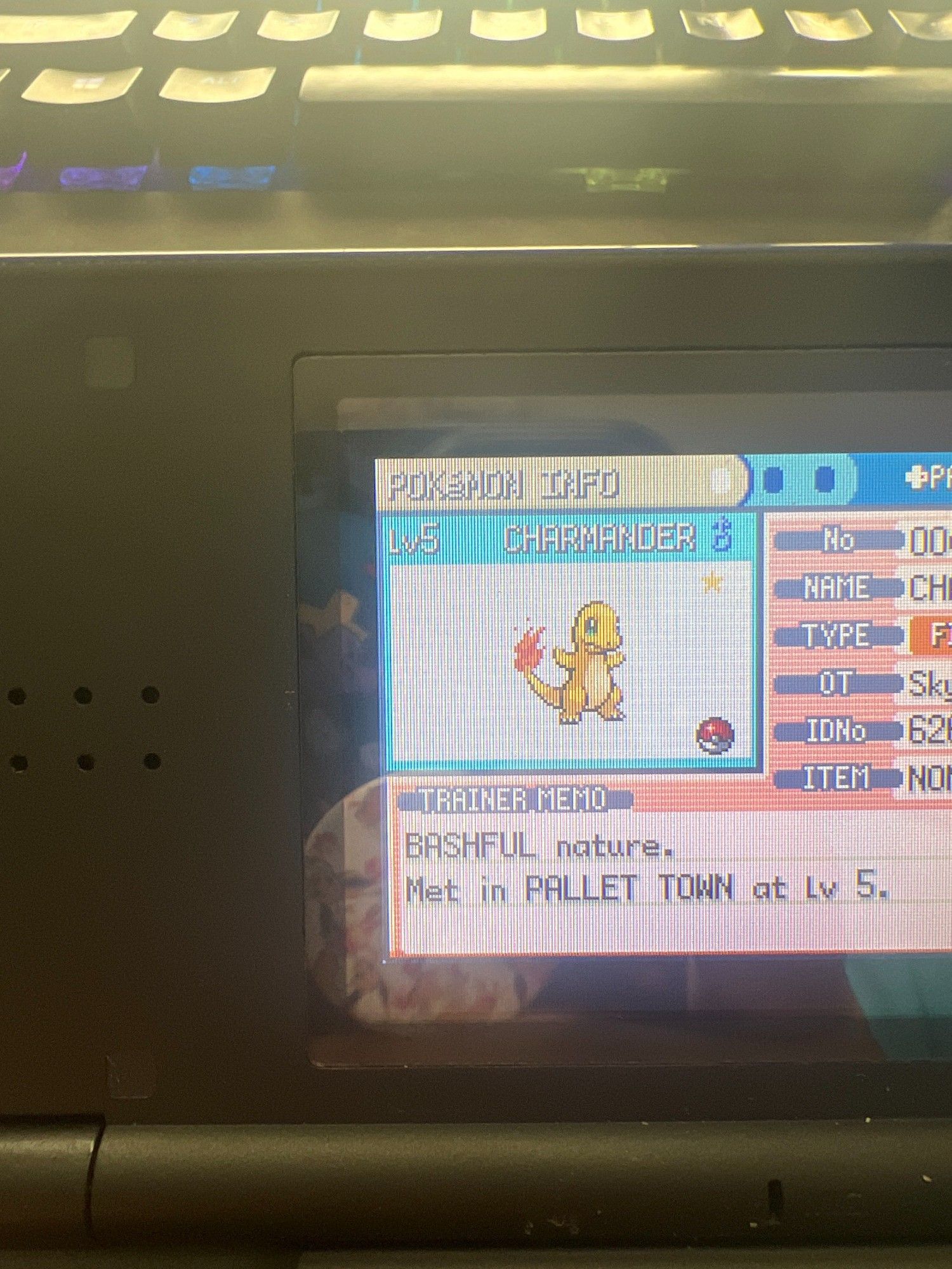 Shiny Charmander photo taken on a DSLite Screen. The Charmander is Level 5, and a Male. It looks like it's the GUI of pokemon fire red.