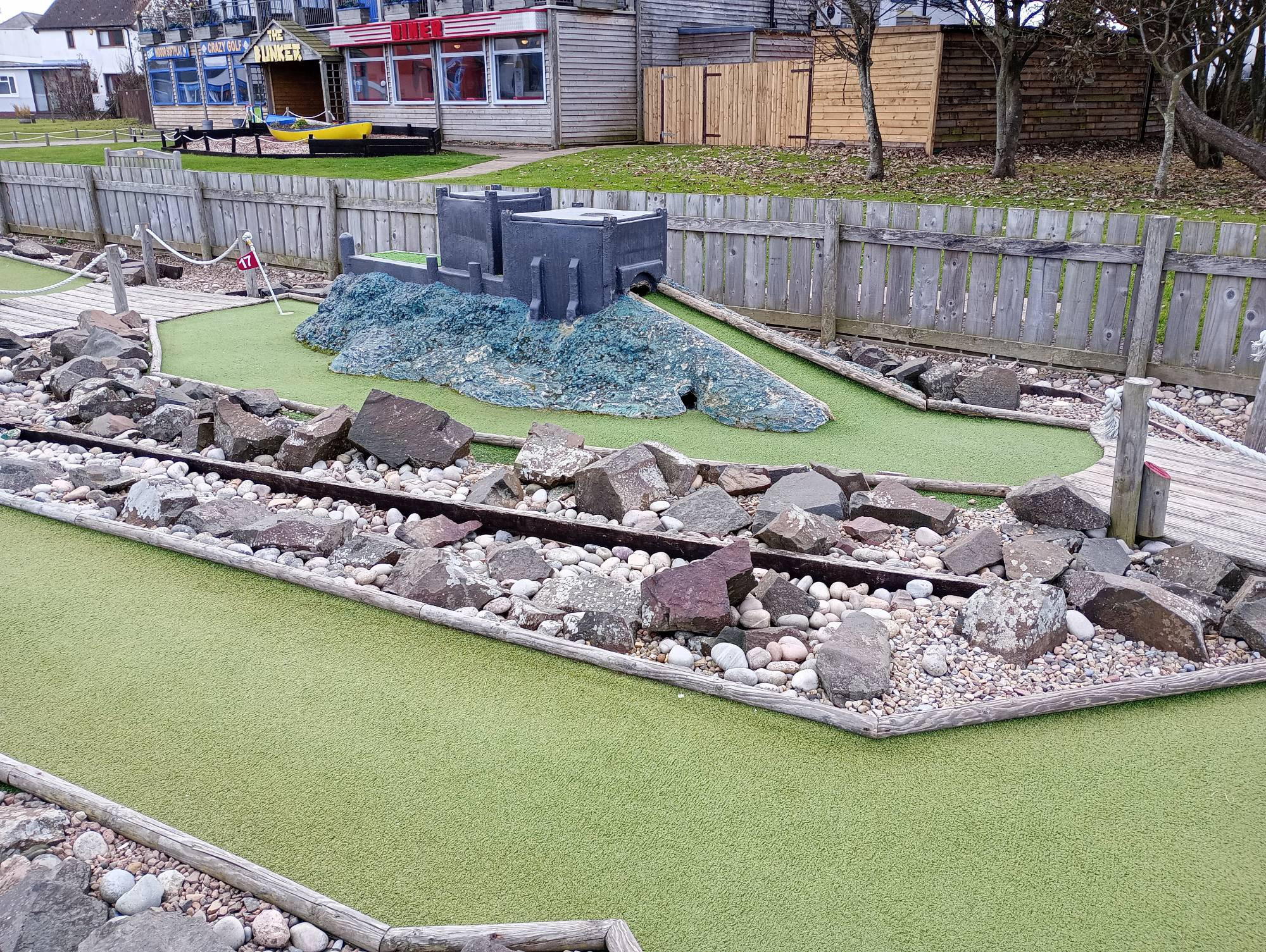 A hole on a mini-golf course built to look like Bamburgh Castle