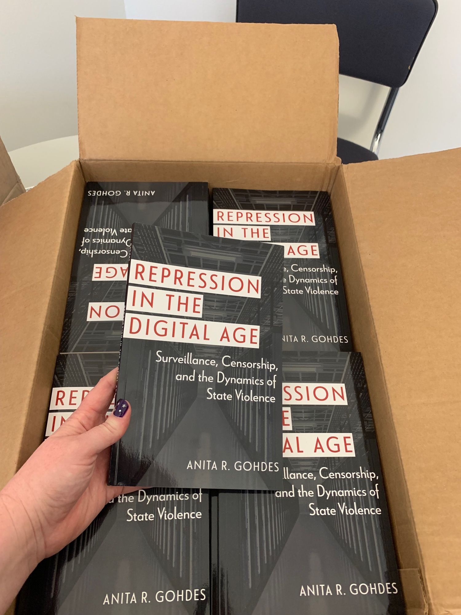 A box full of Anita’s book “Repression in the Digital Age”