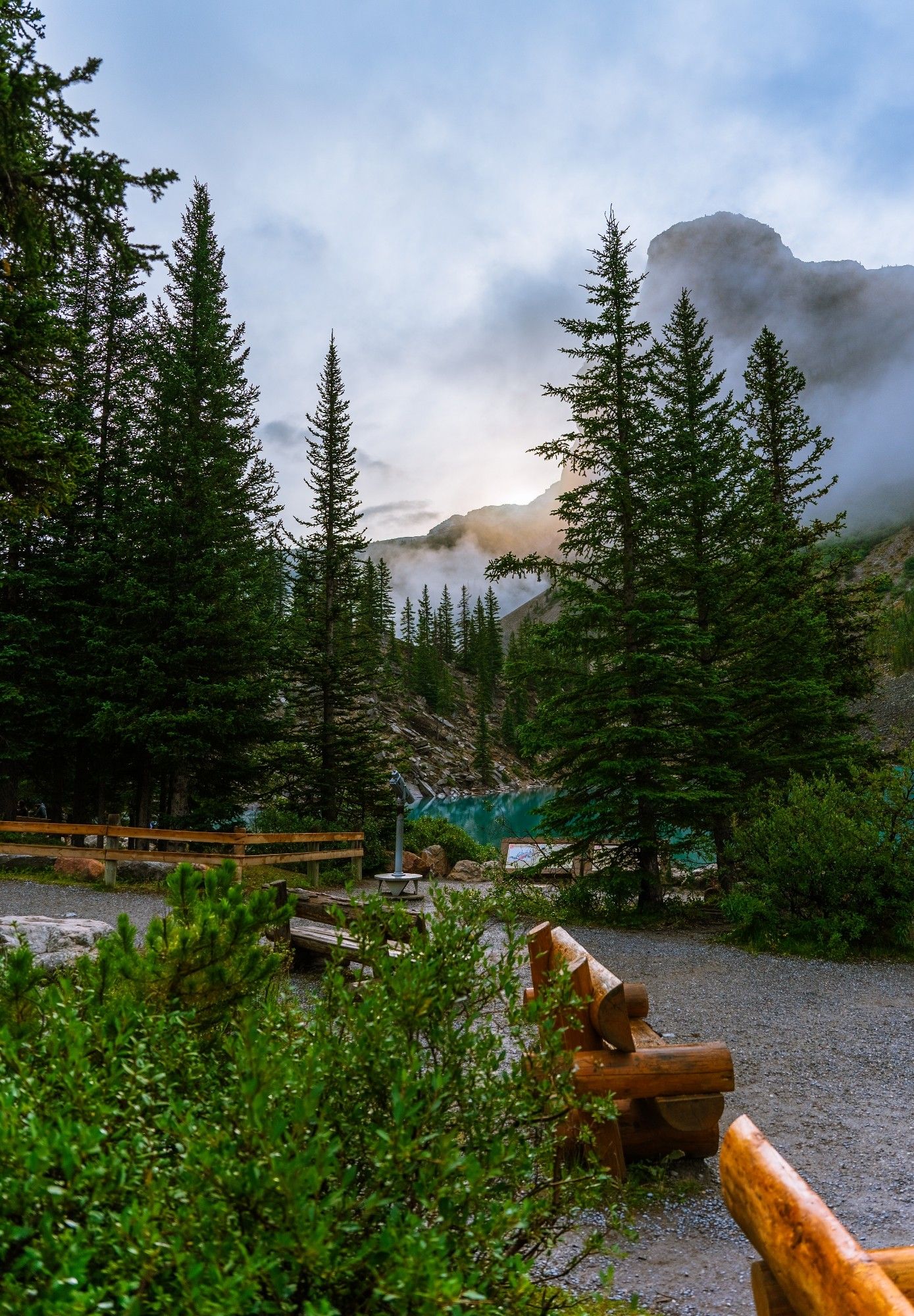 Tower of Babel and The Rockpile shrouded in early morning fog behind tall Rocky Mountain pine trees at Moraine Lake, Banff National Park, Alberta, Canada
Captured by Komeil Karimi