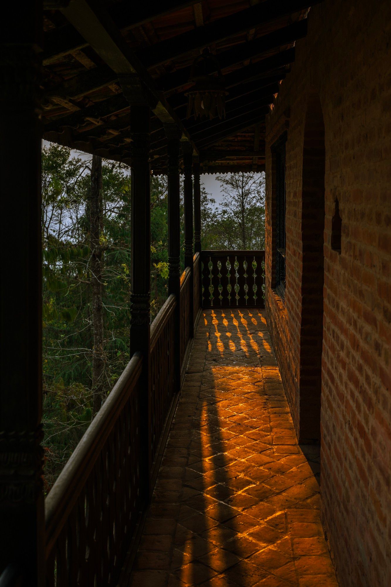 One of the Himalayan peaks facing terraces of guest villas at The Fort Resort, Nagarkot, Nepal lit by warm sunrise light
Captured by Komeil Karimi