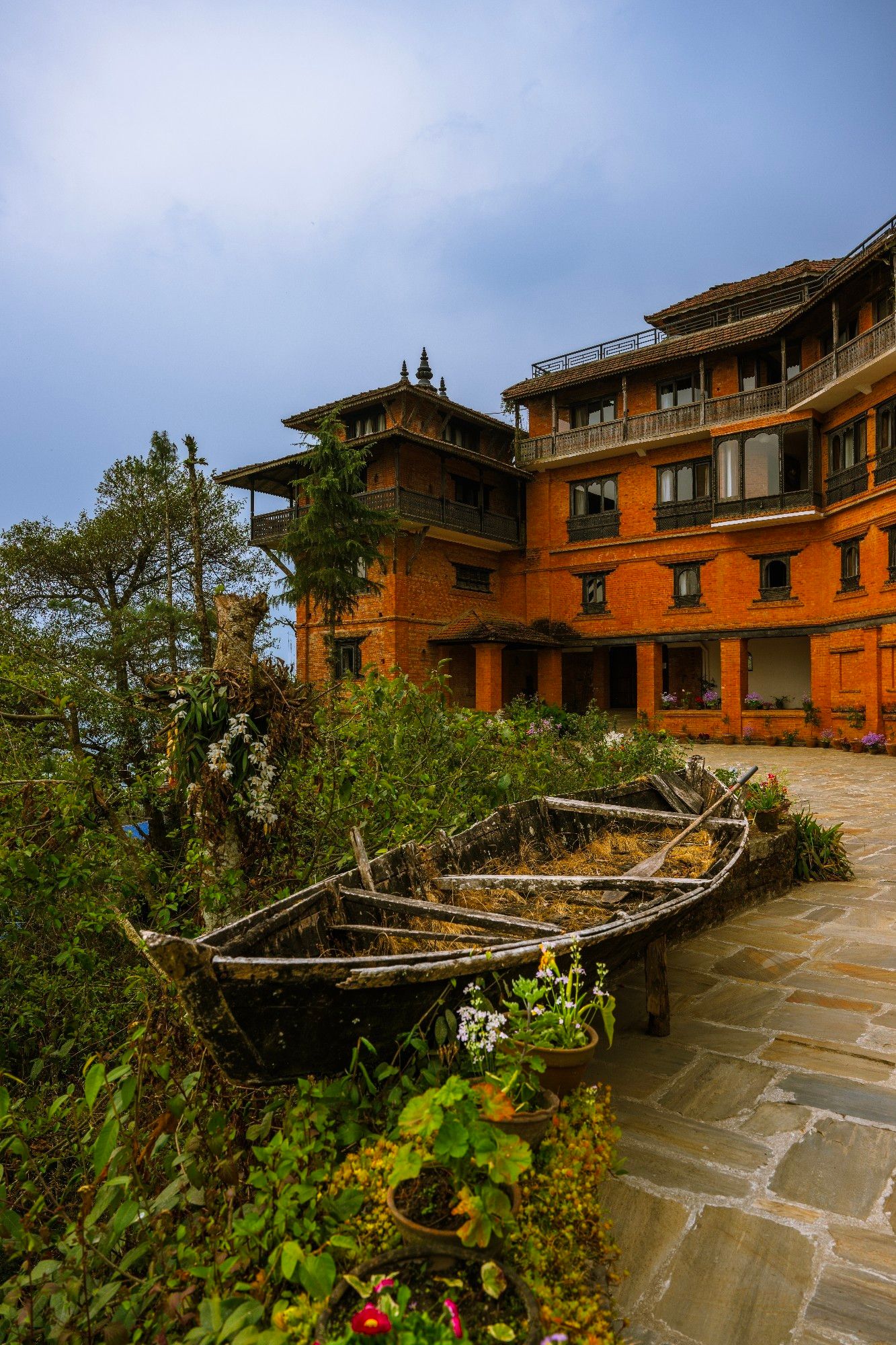 Abandoned rowboat in front of bend of modern and traditional architecture of The Fort Resort, Nagarkot, Nepal
Captured by Komeil Karimi