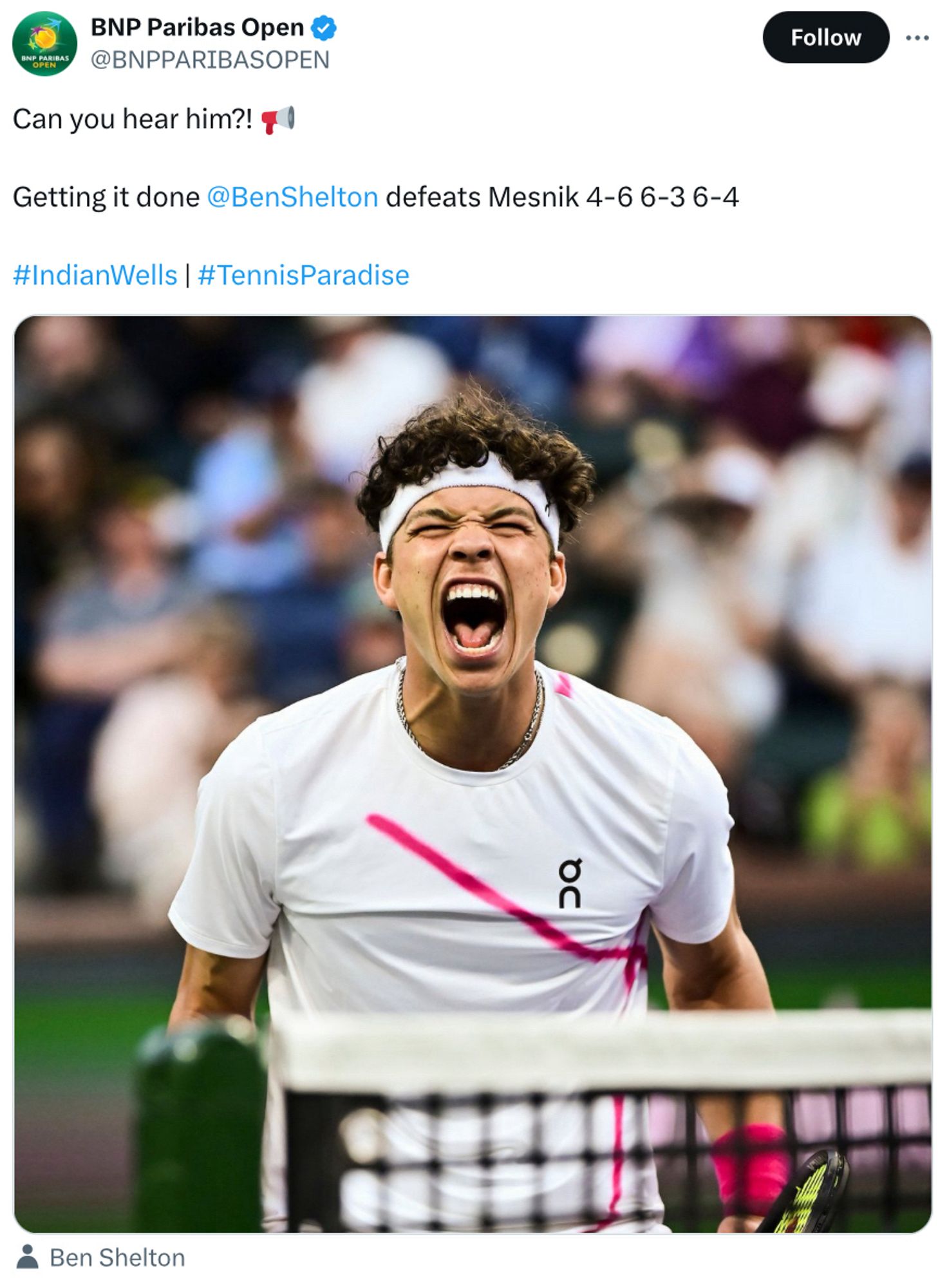 Screenshot of a BNP Paribas Open tweet reading “can you hear him? <megaphone emoji> 
Getting it done @benshelton defeats Mesnik 4-6 6-3 6-4 
#IndianWells #TennisParadise”
With a photo of an exuberant Ben Shelton screaming on court 1