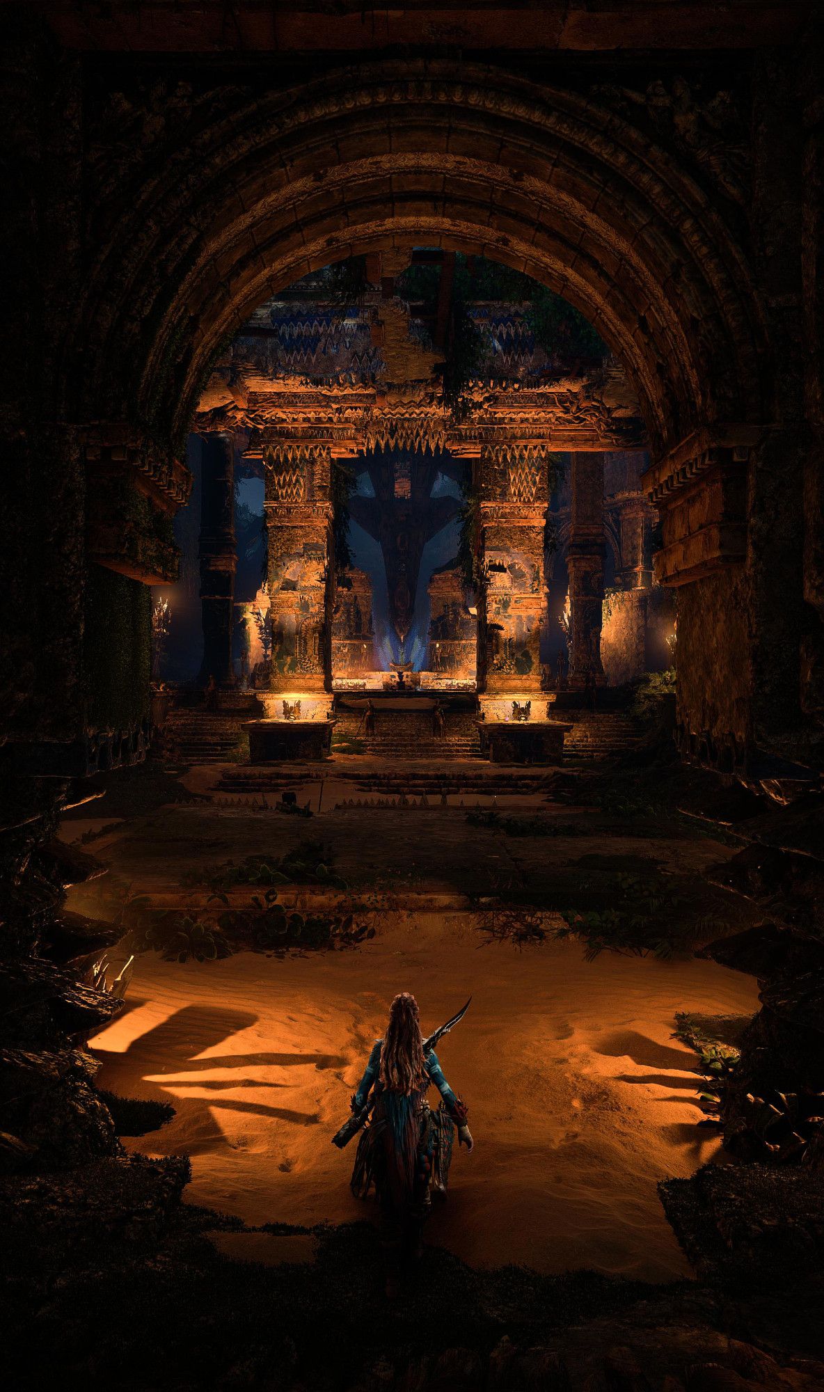 virtual photography of Horizon Forbidden West, Aloy standing at the entrance to ruins, lit by fire torches, under an arch.