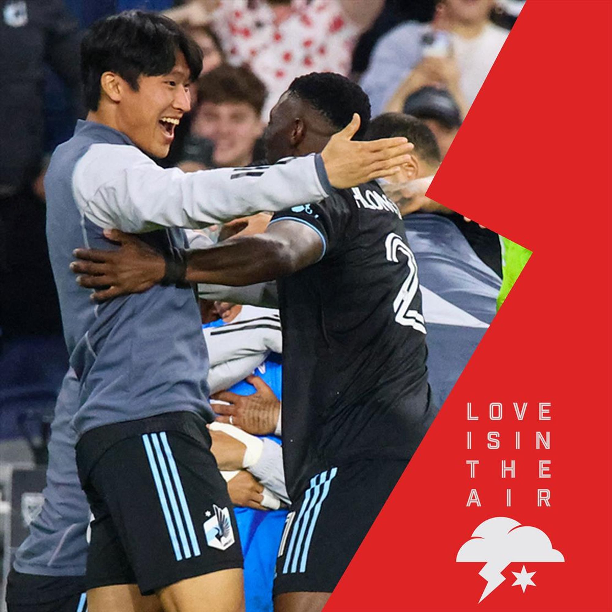 a photo of Sang Bin Jeong and Bongi Hlongwane celebrating together after a match with the text LOVE IS IN THE AIR and the Dark Clouds logo