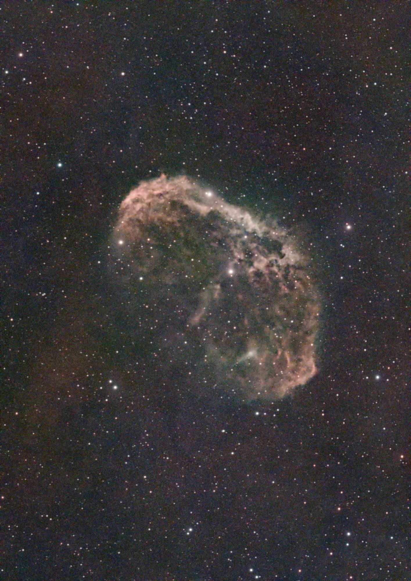 The Crescent Nebula in Cygnus, around 5000 light years from Earth.  It's a bubble about 25 light years across blown by stellar winds from a central star. The complex structures are likely a result of the interaction of the stellar wind interacting with previously ejected material.