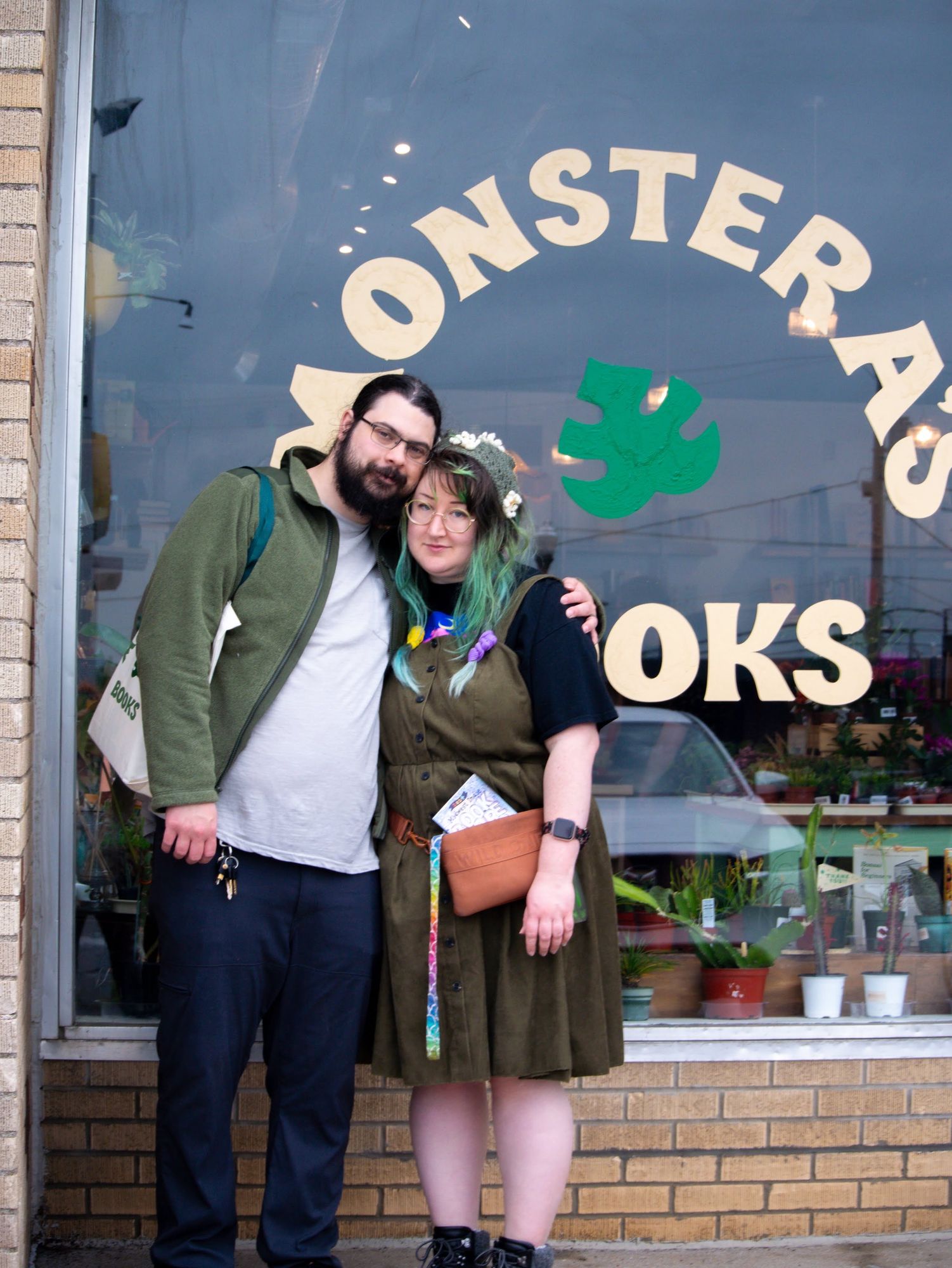 my husband and i standing outside “Monstera’s Books”, a local bookstore in Overland Park, KS