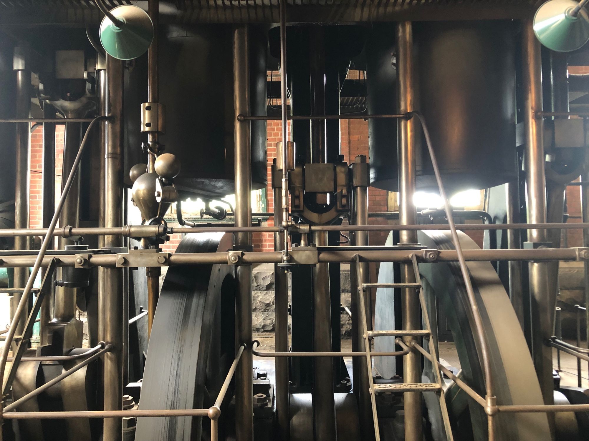 Enormous 100-year-old machinery with large wheels, bars and working parts