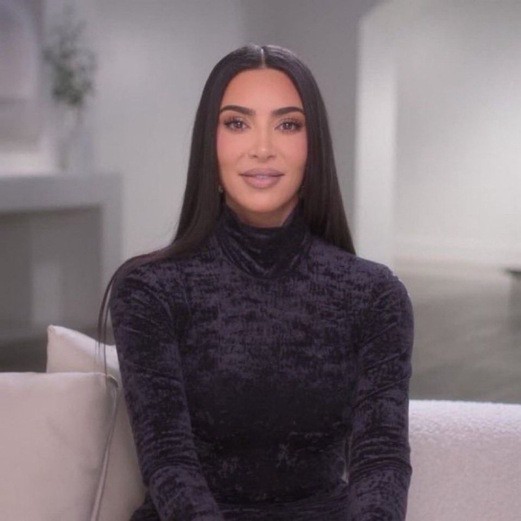 Kim Kardashian (I think?) sitting down and looking into your soul