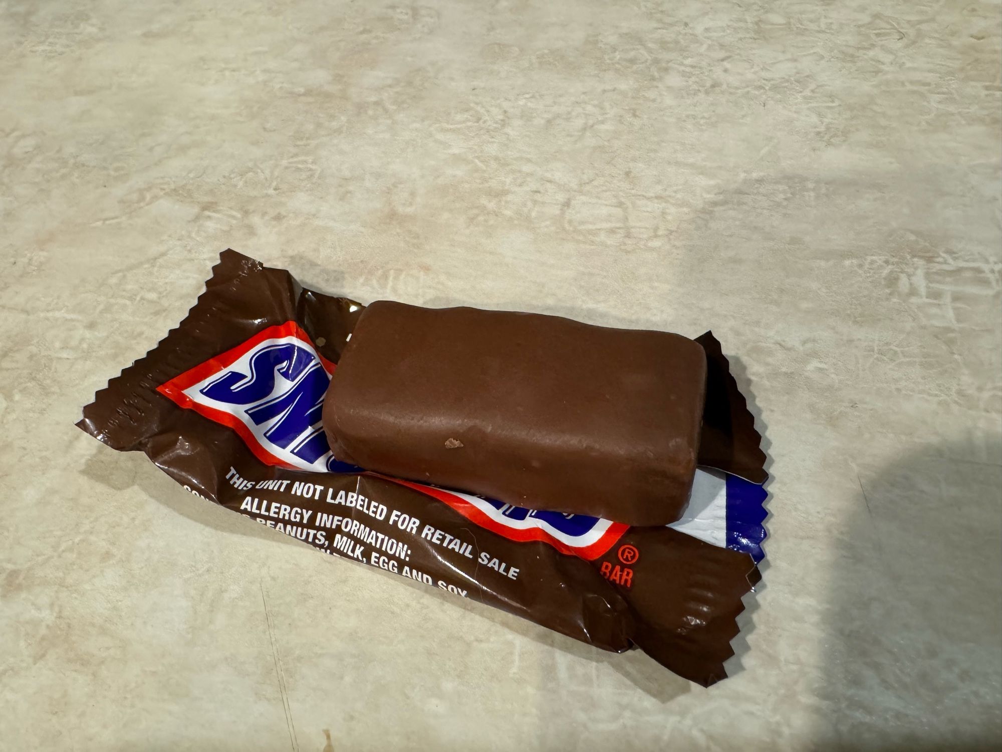 an Eerily Smooth Snickers Bar