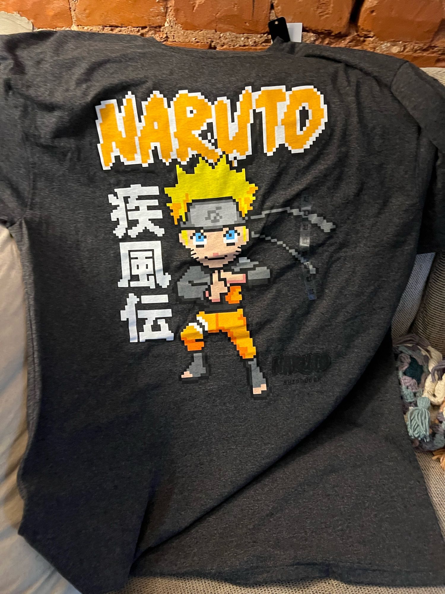 Dark heather gray t shirt with pixel art Naruto graphic