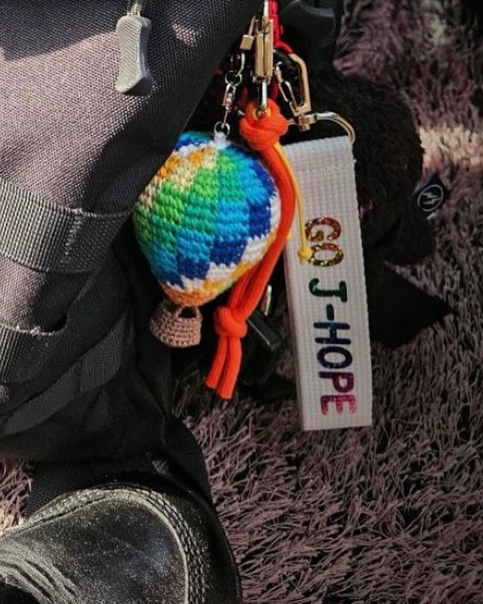 Bag charms on j-hope’s military bag. HYYH balloon and Go J-Hope