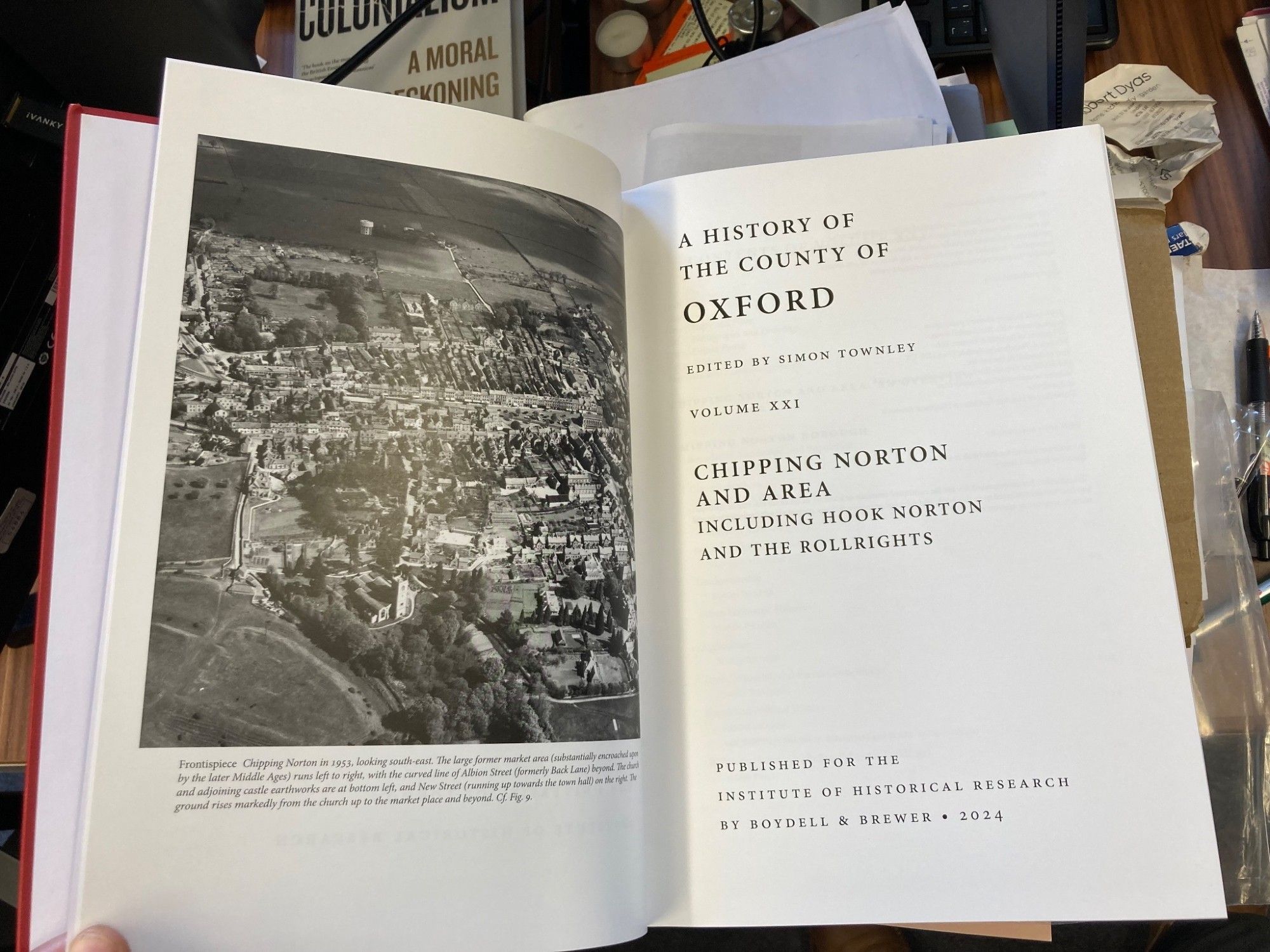 Title pages with an aerial photo of the town of Chipping Norton.