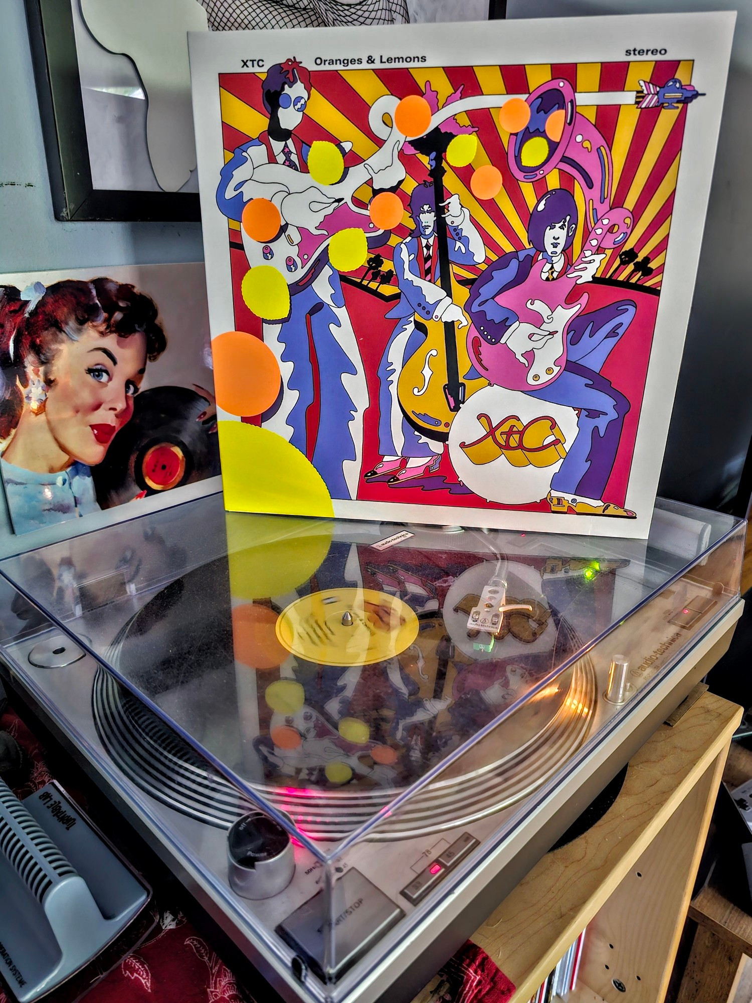 A vinyl LP of XTC's "Oranges & Lemons" sitting atop a turntable.