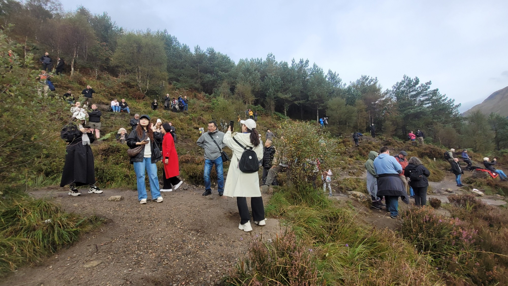 Tourists at the Glenfinnan Viaduct Viewpoint.