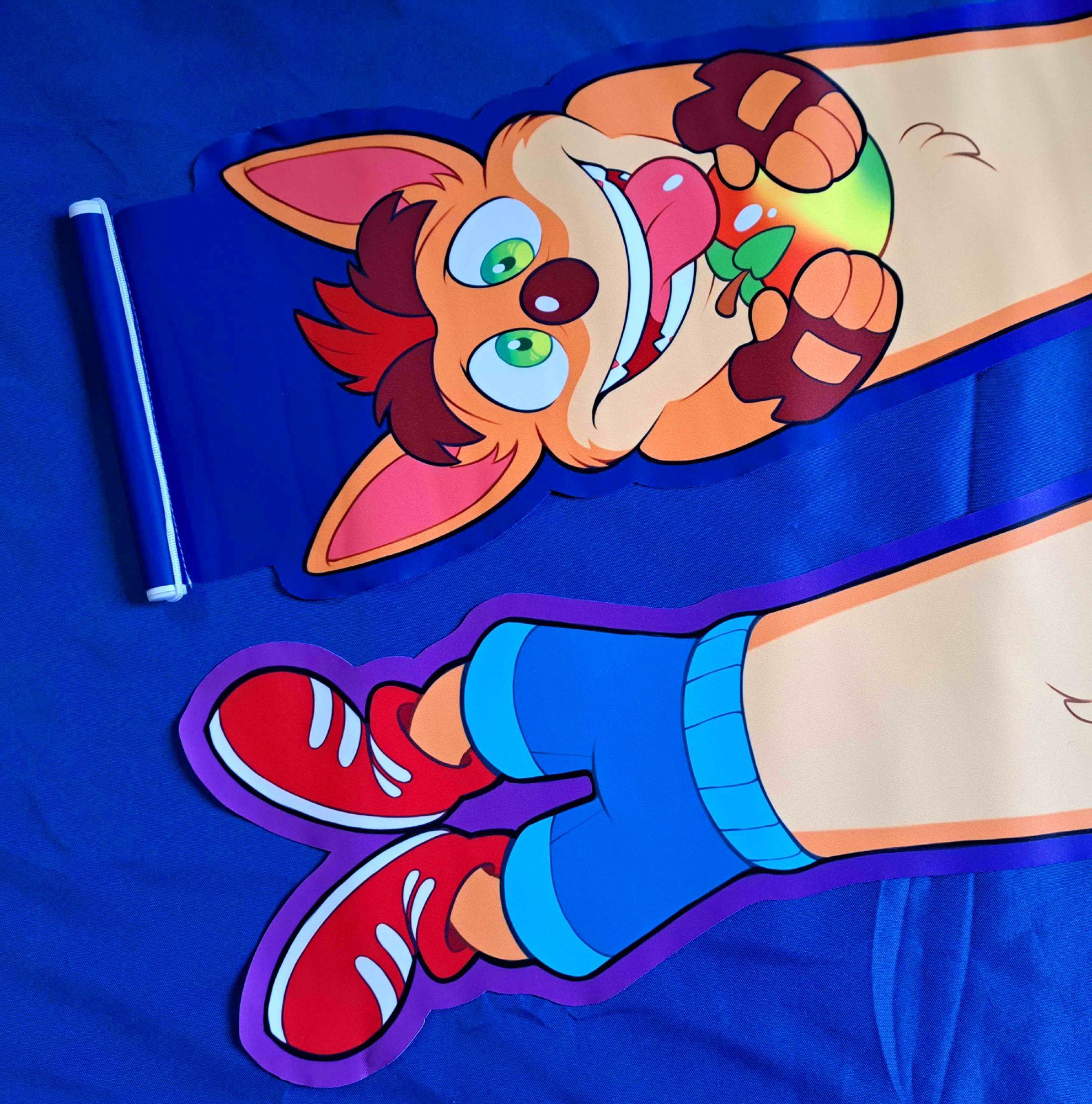 A photograph of a pin banner depicting an elongated Crash Bandicoot (two of them laid at opposite ends side by side to fit in the frame).