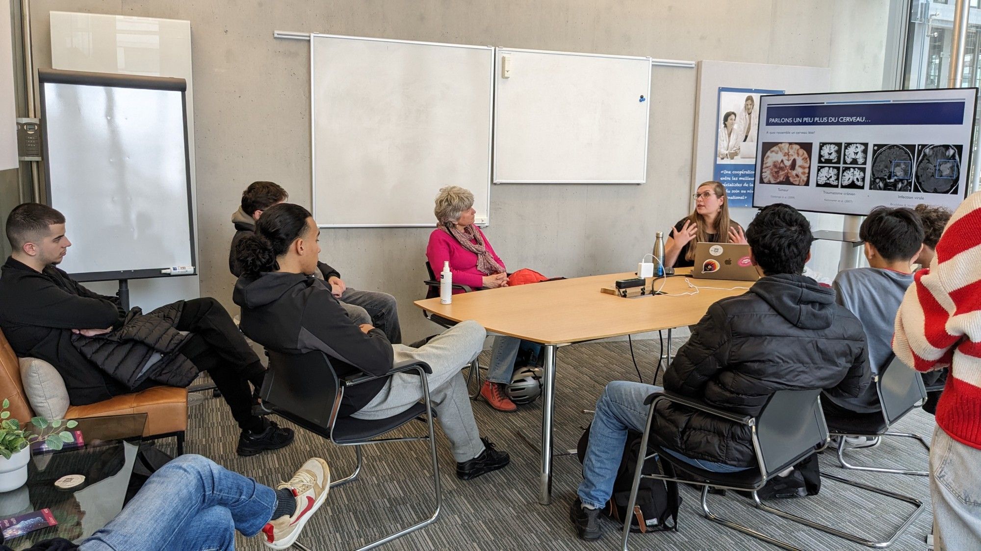 A group of students listening to a talk on the neural basis of language