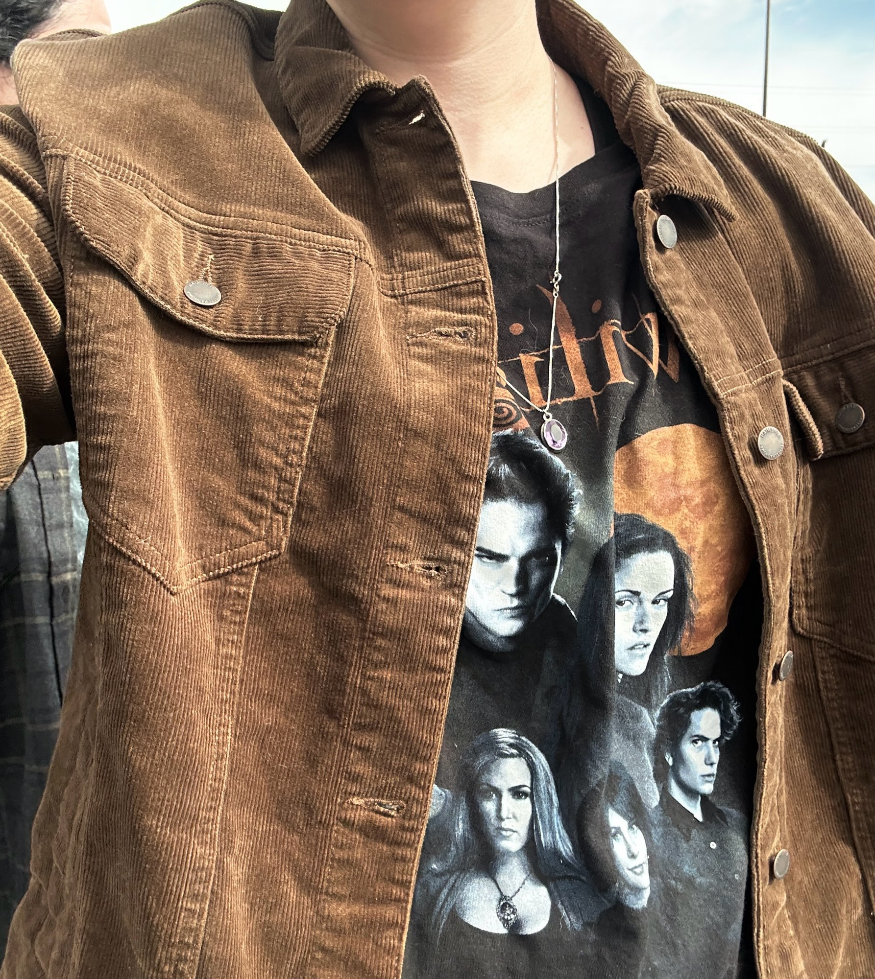 Cropped photo of a twilight shirt under a very Bella Swan esque brown courderoy jacket