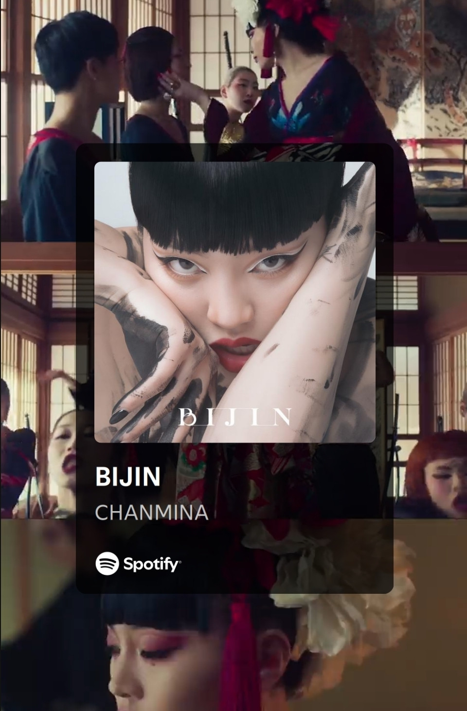 Album cover for "BIJIN by CHANMINA" close up picture of singer, fierce eyes, gritted teeth, black bangs while head rests between one of her arms and her hand